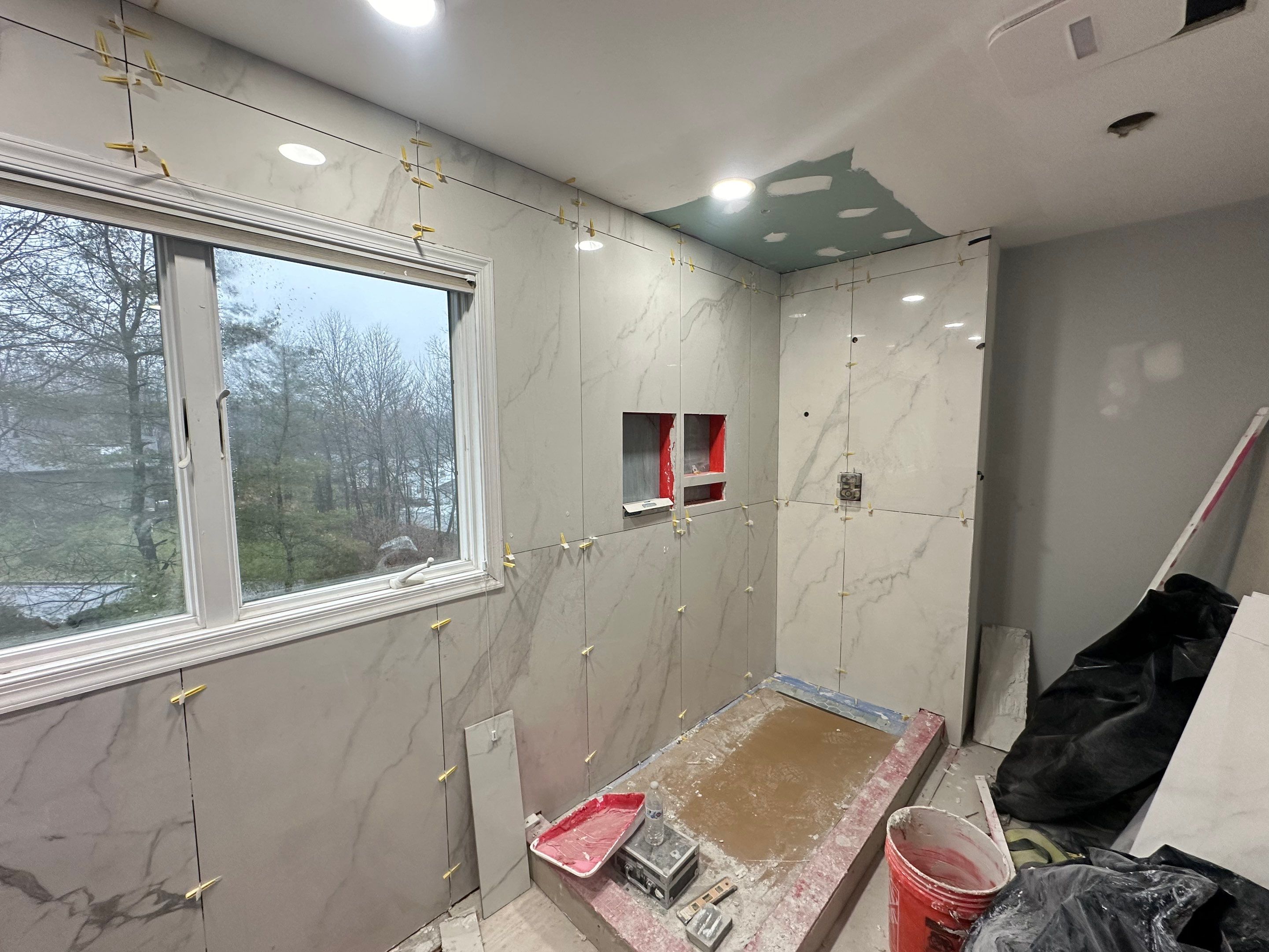 Bathroom Remodel using Tile by Home Concepts Construction