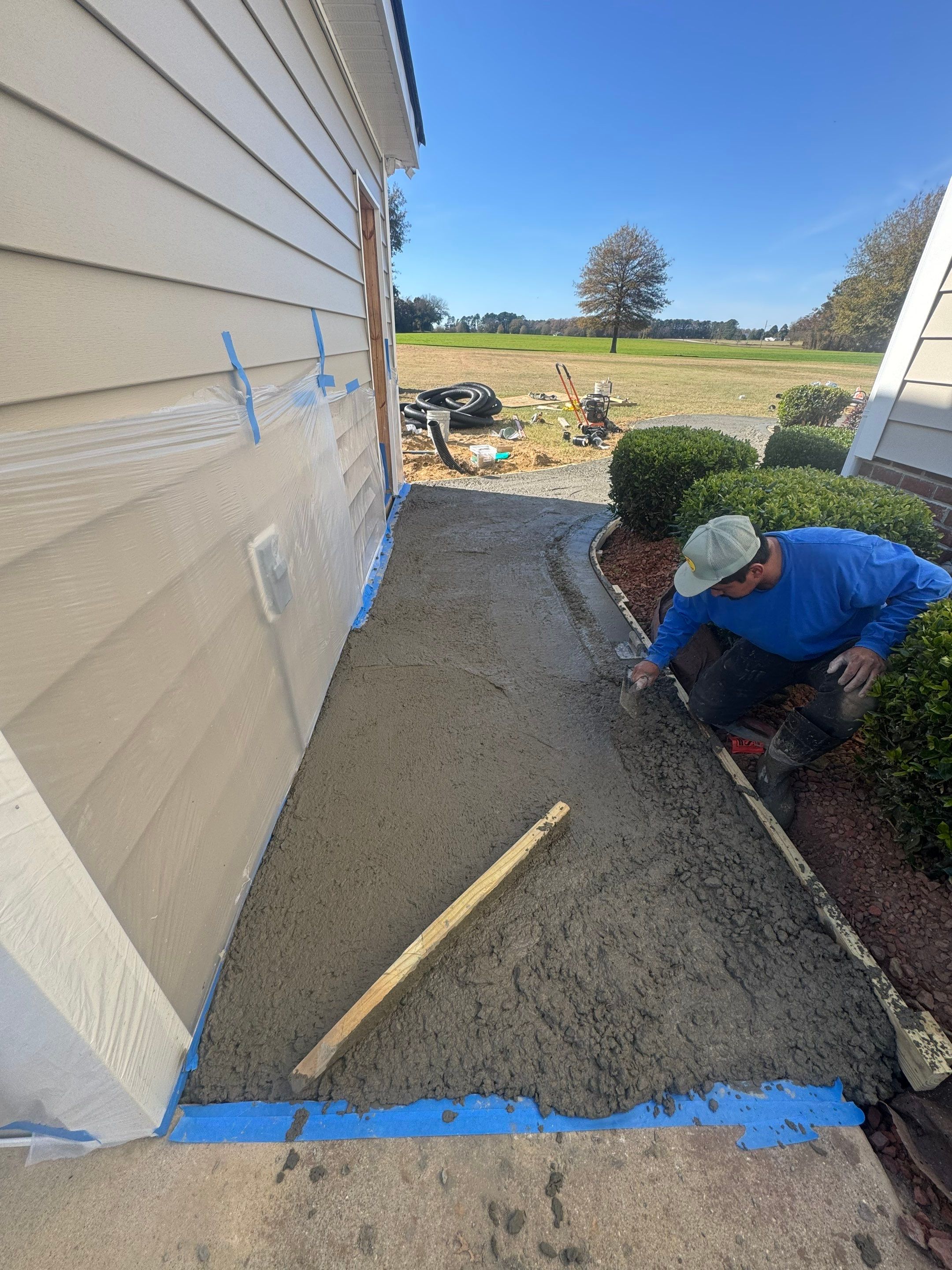 Custom Screened Porch and Concrete Walkway Installation in Rocky Mount by The Remodeling Company