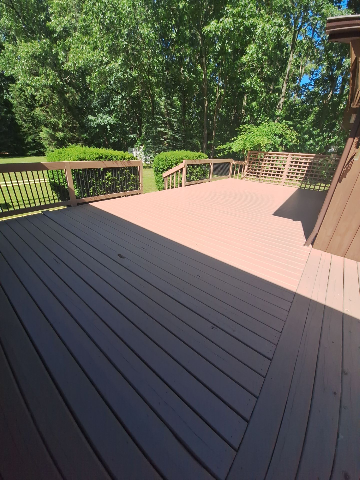 Muskegon Deck Restoration with Pressure Treated Railings and Wood Staining by Gordon Painting