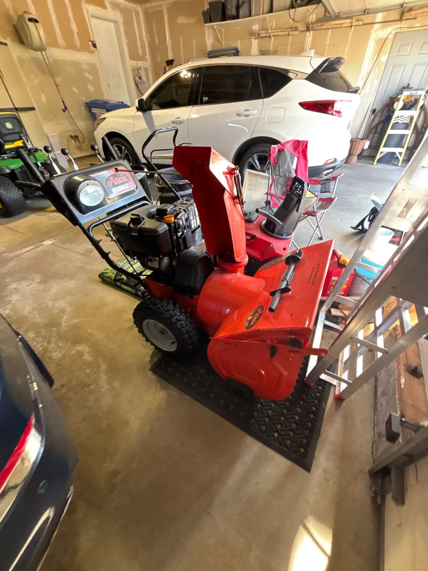 Sioux Falls Garage Concrete Repair and Epoxy Flake Floor Coating by Select Painting, Coatings & Garage Cabinets