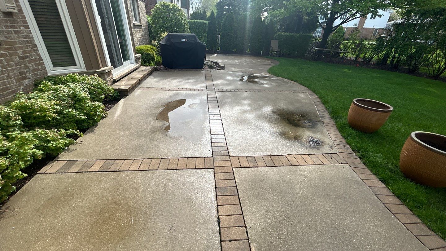 concrete patio and driveway cleaning by Northern Power Washing LLC.