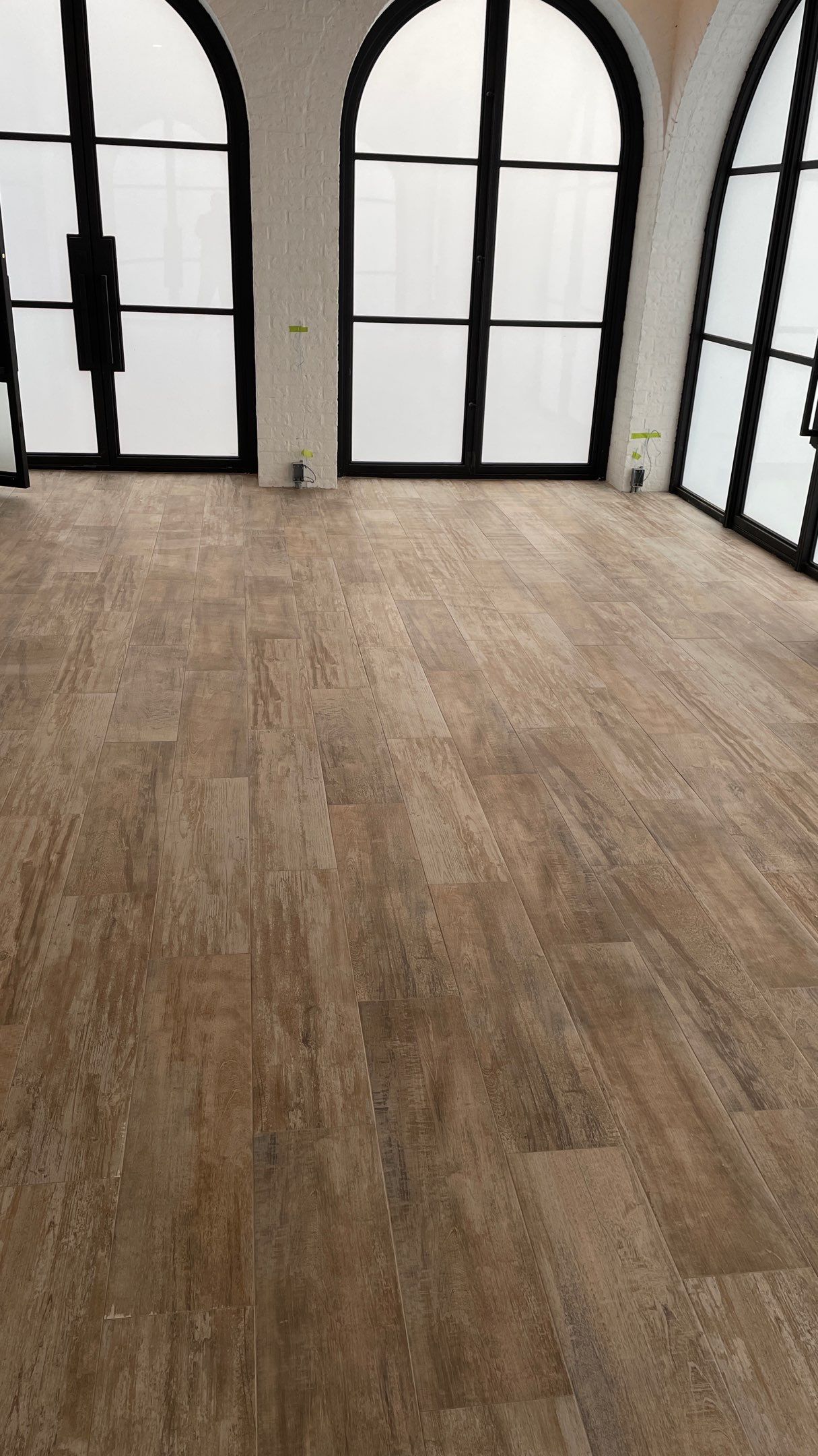 Instant Transformation of this Beautiful Sunroom by Footprints Floors of Coastal Carolina