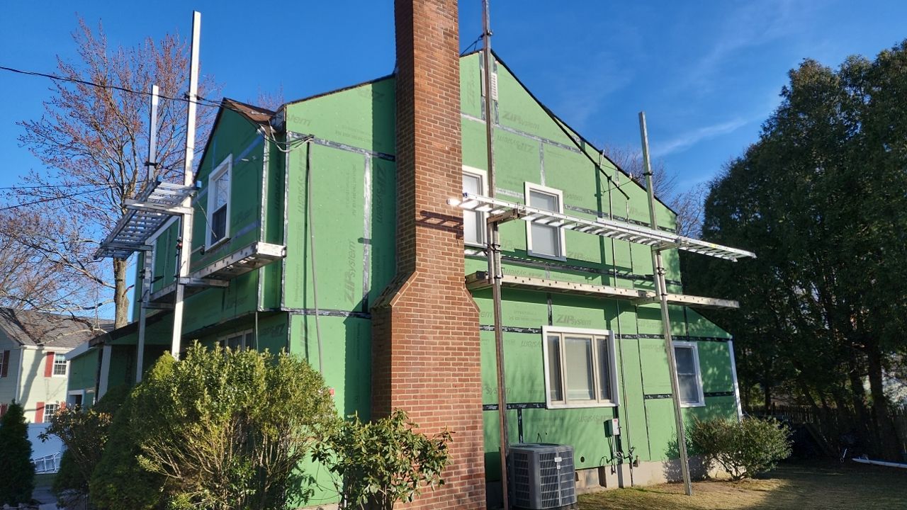 James Hardie siding, new metal roof and couple windows being installed. by UBrothers Construction