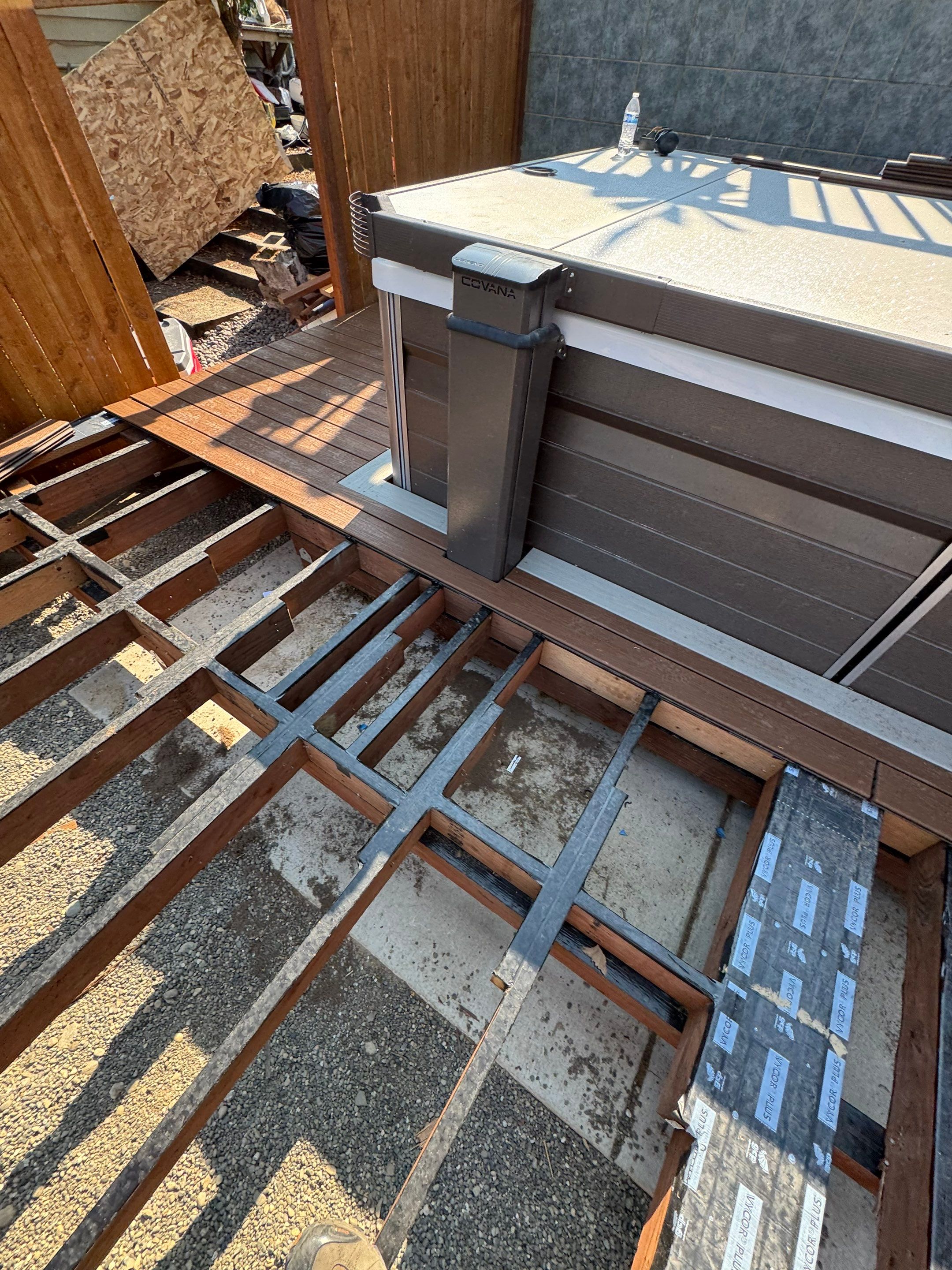 Tacoma Custom Composite Deck and Hot Tub Surround with Retaining Wall by Emerald City Energy 