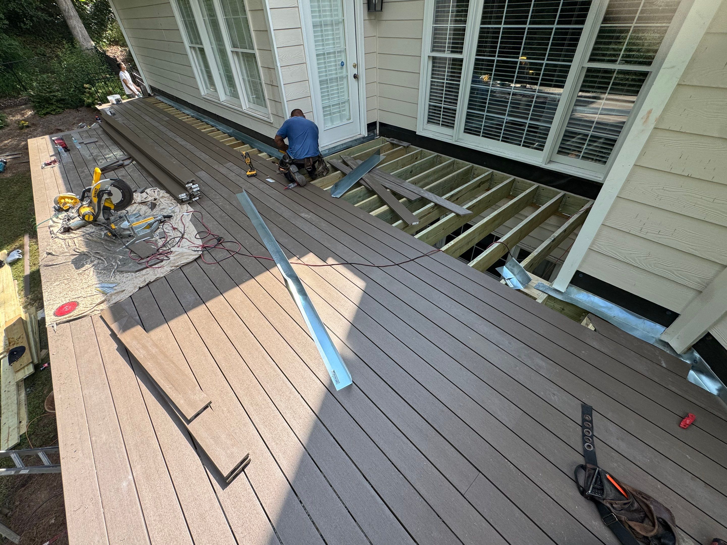 Elevated Composite Deck Replacement with Metal Railings in Smyrna by Swift Home Renovations 