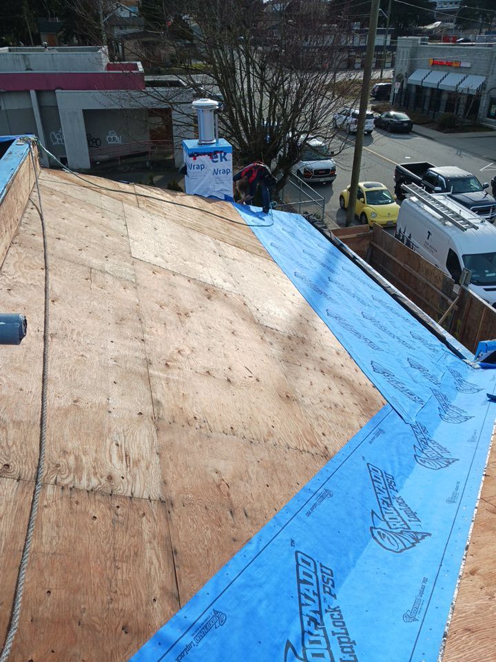 Commercial Roofing Installation using 12" Prolok metal and hidden gutters! by Top Notch Roofing Inc