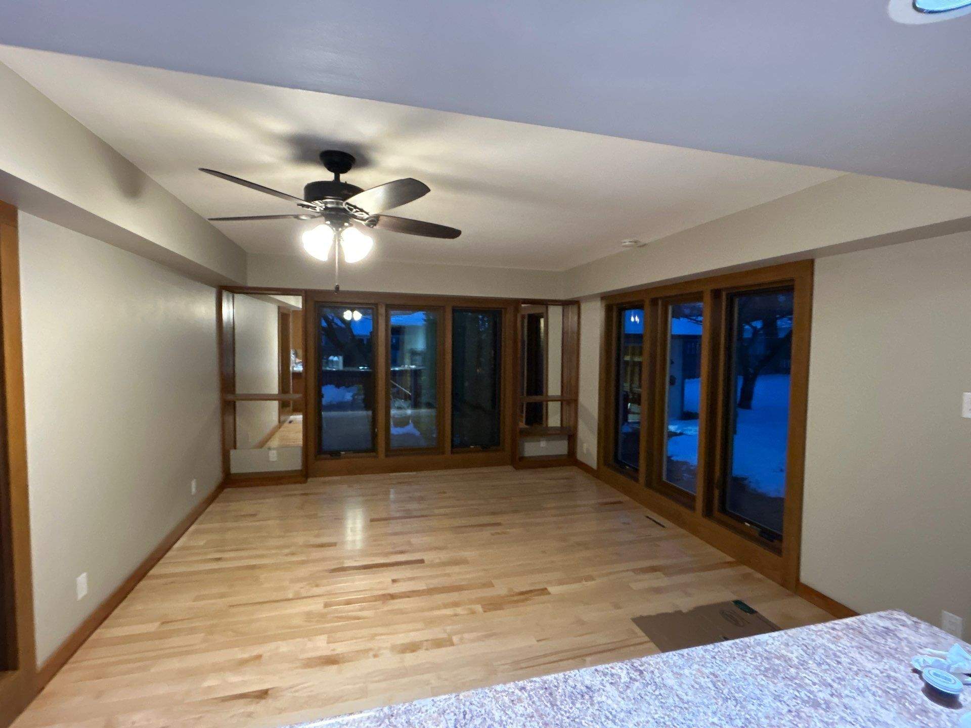 Black-Frame Pella Lifestyle Upgrade on a Partial Brick Home by United Windows and Siding LLC