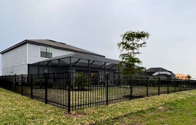 Aluminum Fence Installation using Black 3 Rail Aluminum Fence