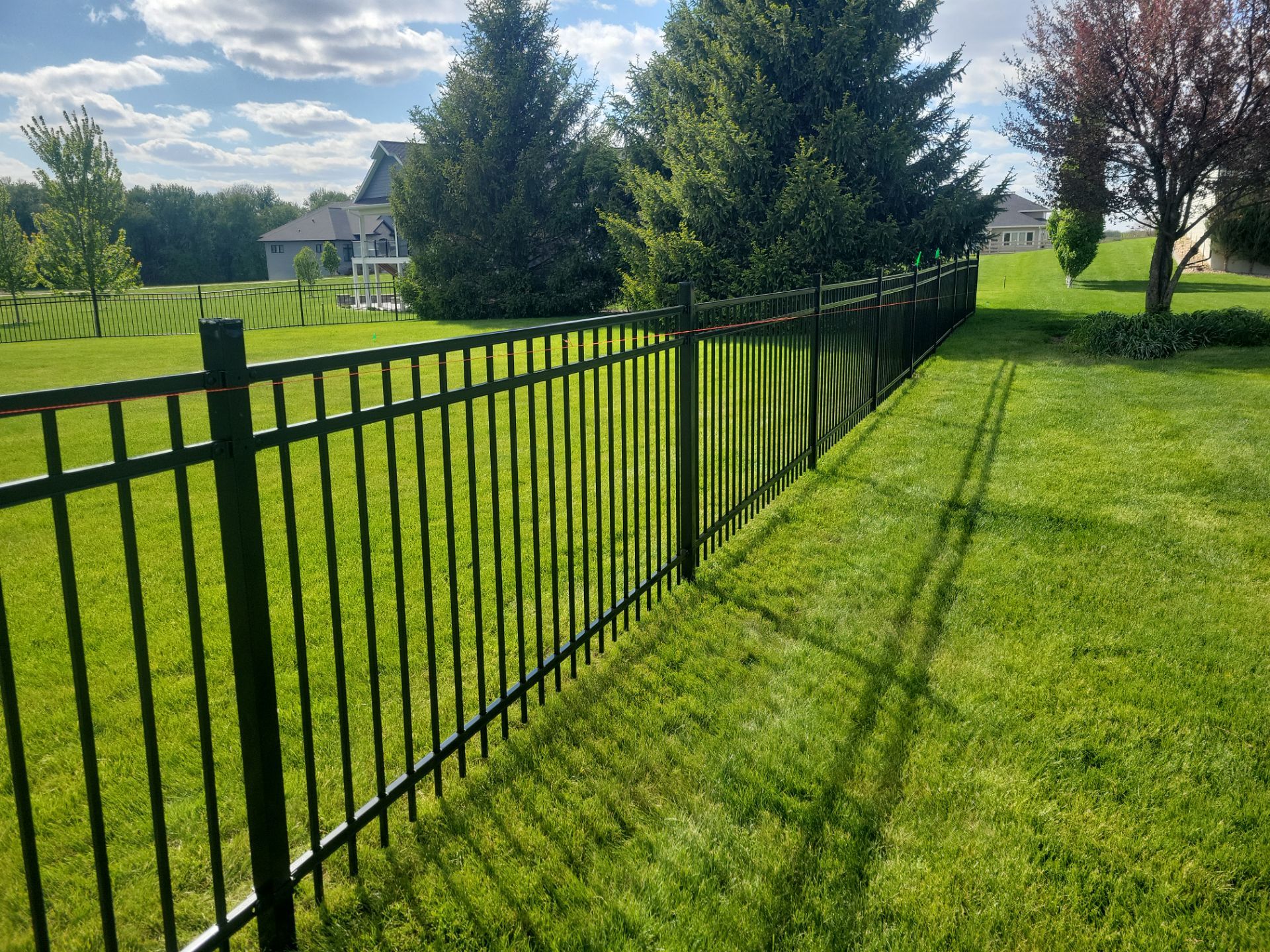 Black Ornamental Metal Picket Fence Installation in Waterloo by Perfect Picket Fence and Stain