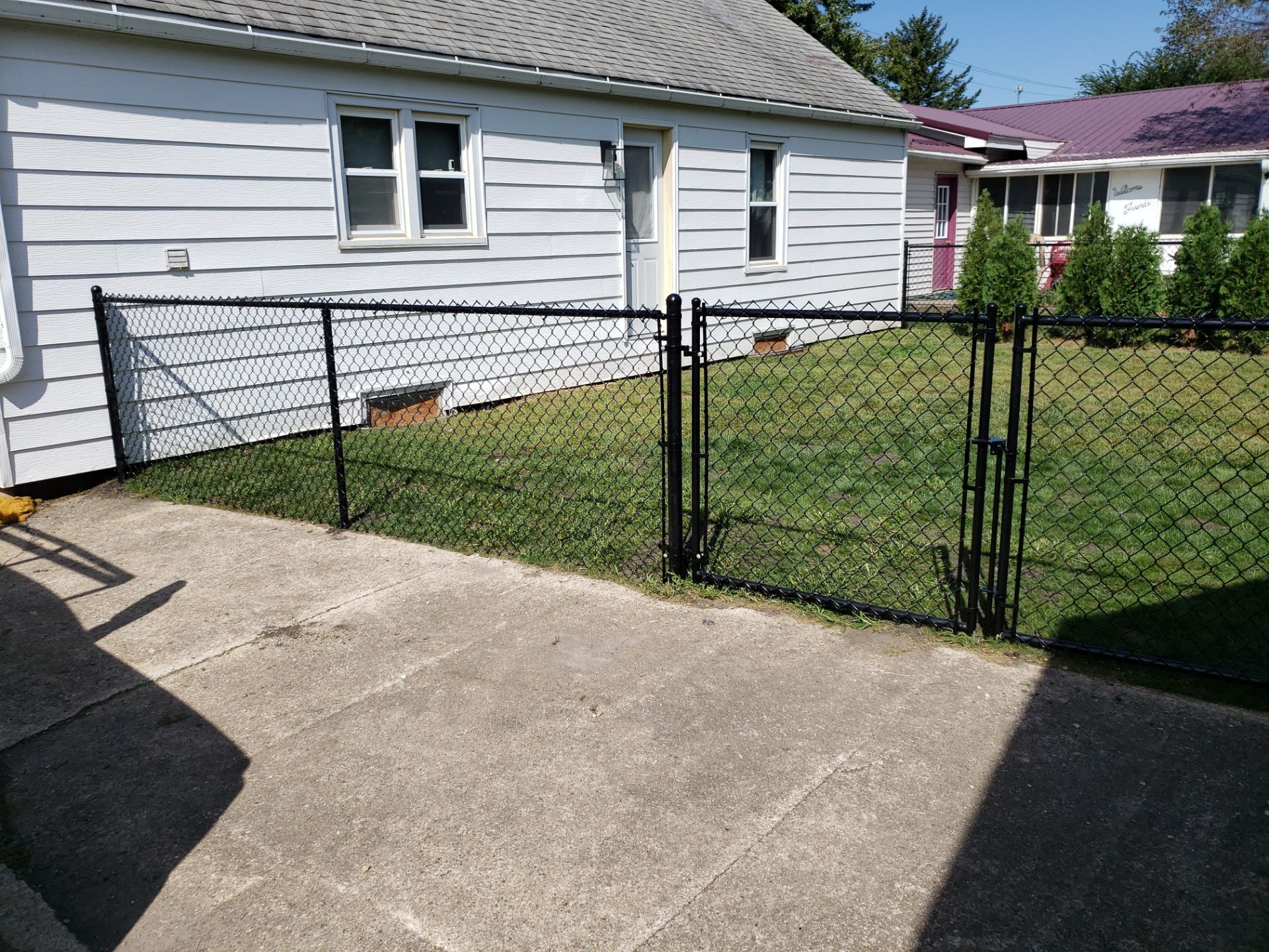 Residential Black Chain Link Fencing Project in Wellburg, Iowa by Perfect Picket Fence and Stain