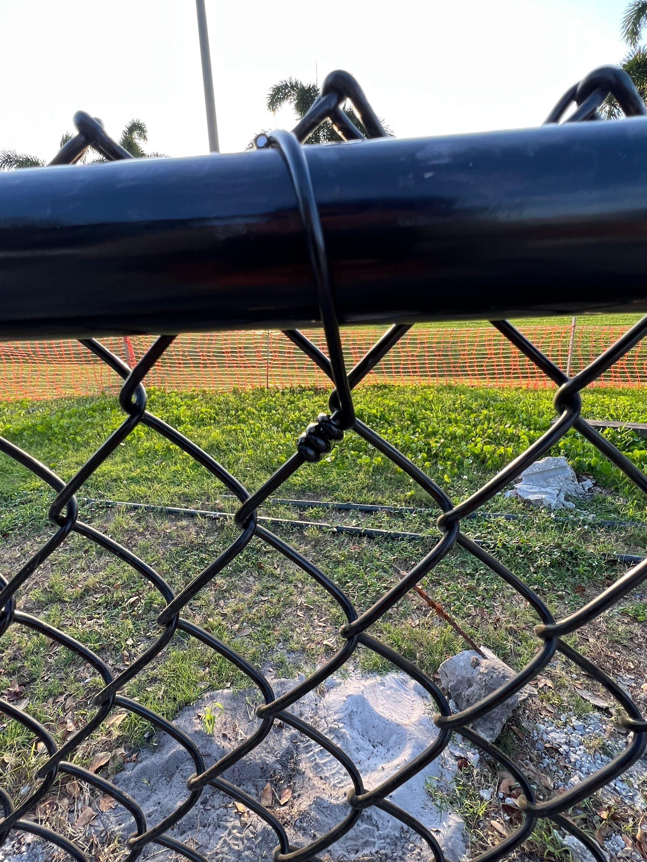 Vinyl Coated Chain-link fence for the City of Naples around Fleischmann Park Playground.  by Asap fence and gates, LLC
