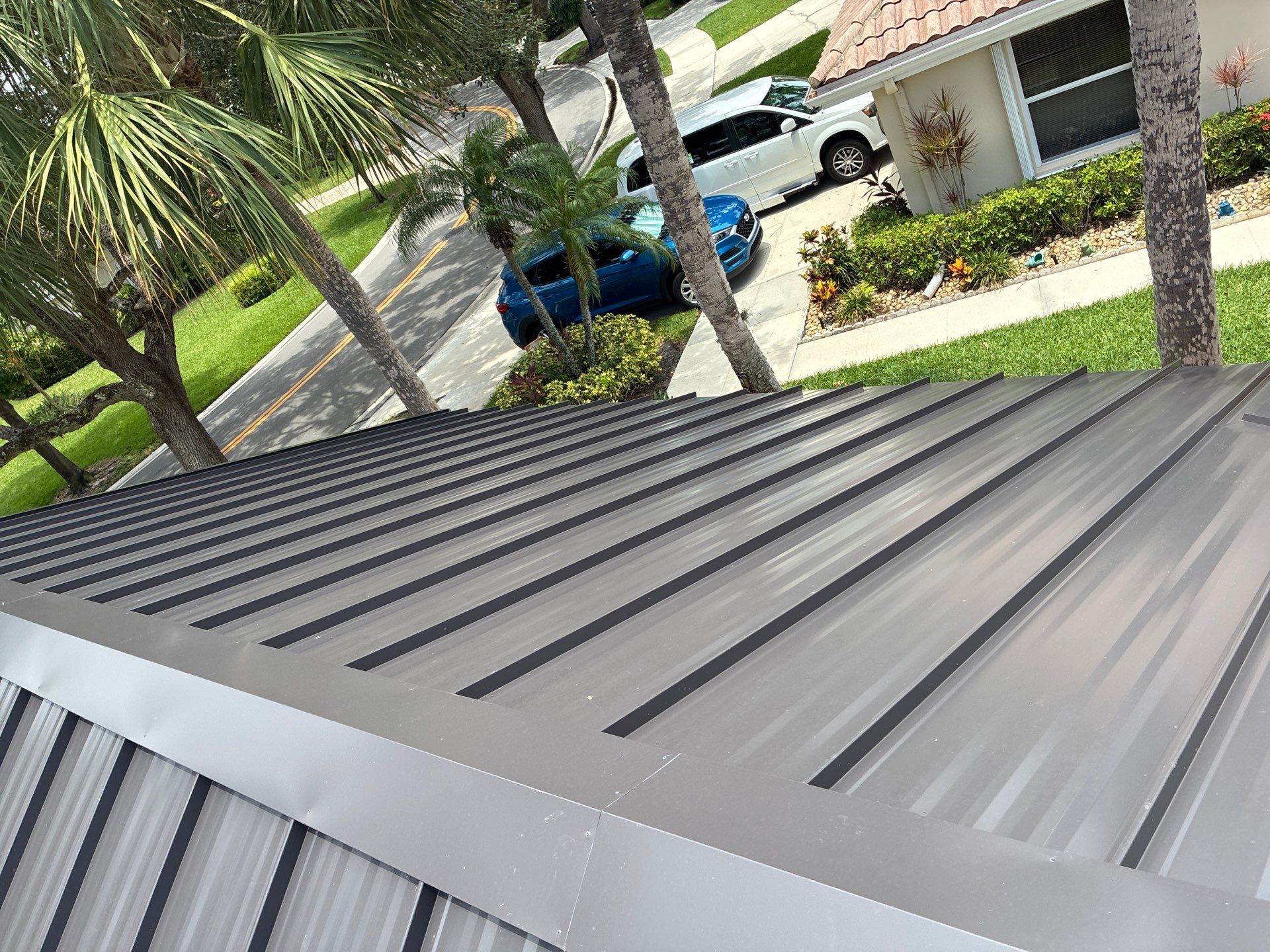 24ga 1.5" Mechanical Seam Dark Bronze by Total Roofing System The Metal Roof Experts