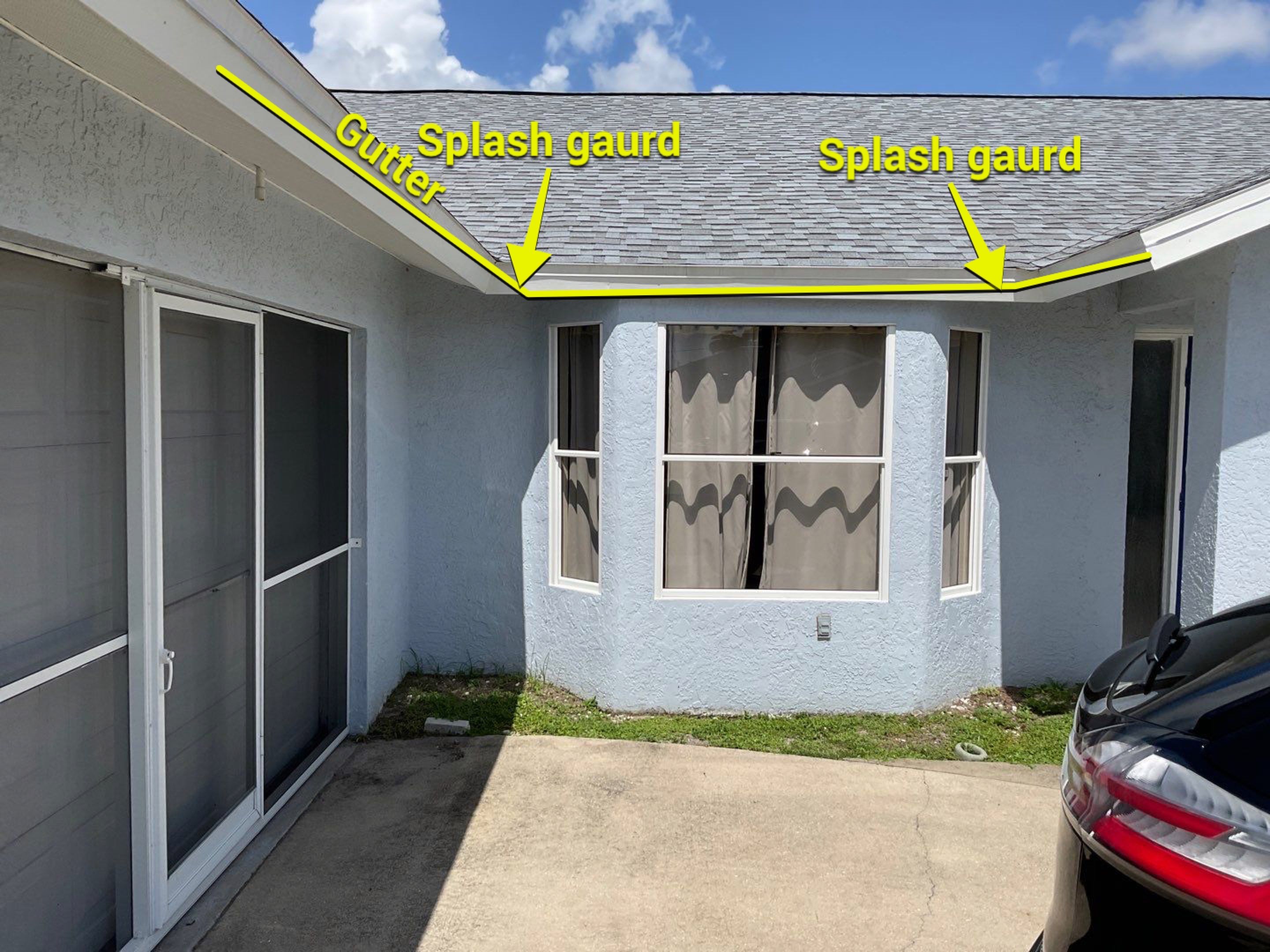 New White Seamless Gutters with Downspouts and Splash Guards in Cape Coral FL by Gutter Professors