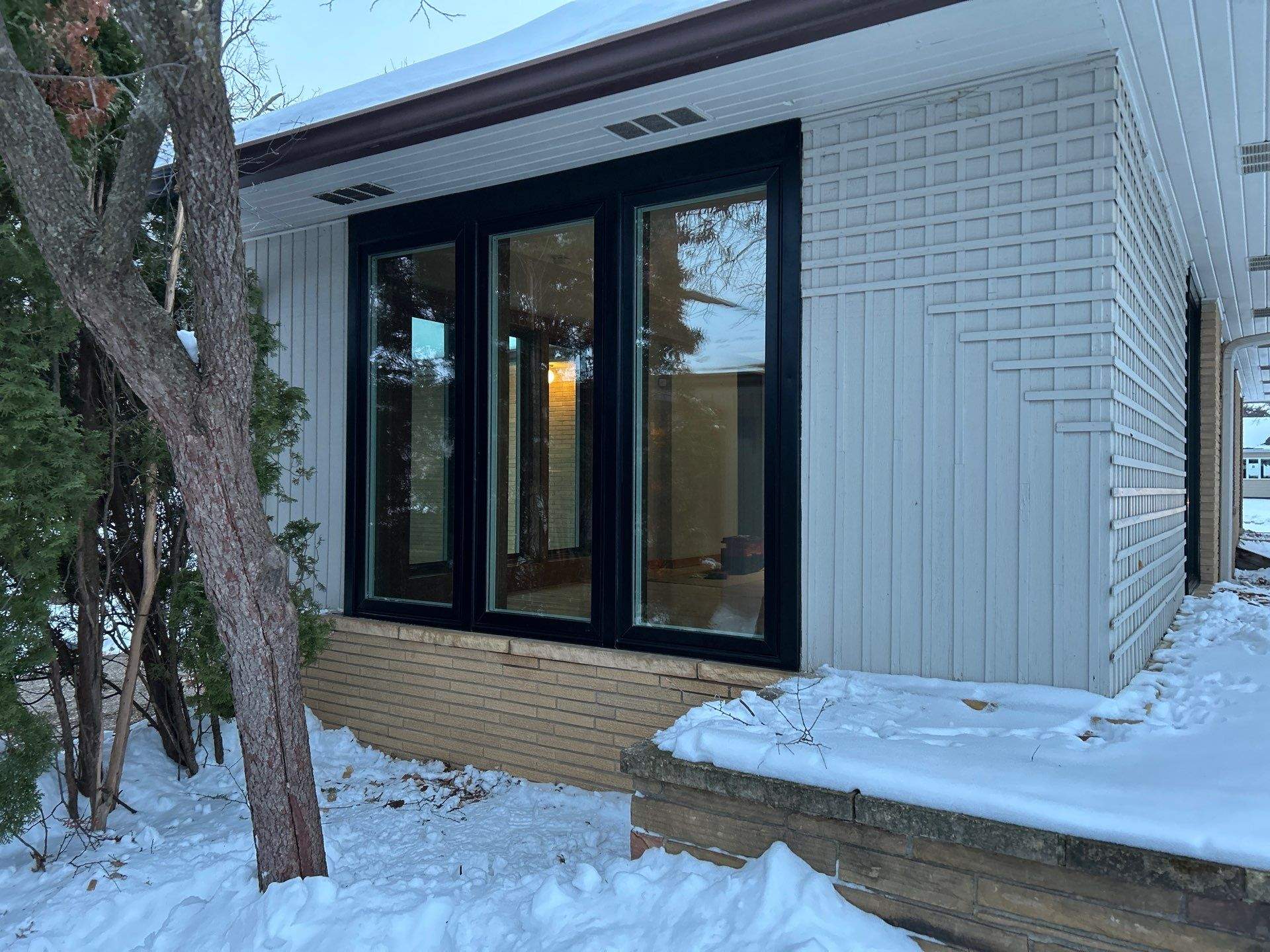 Black-Frame Pella Lifestyle Upgrade on a Partial Brick Home by United Windows and Siding LLC