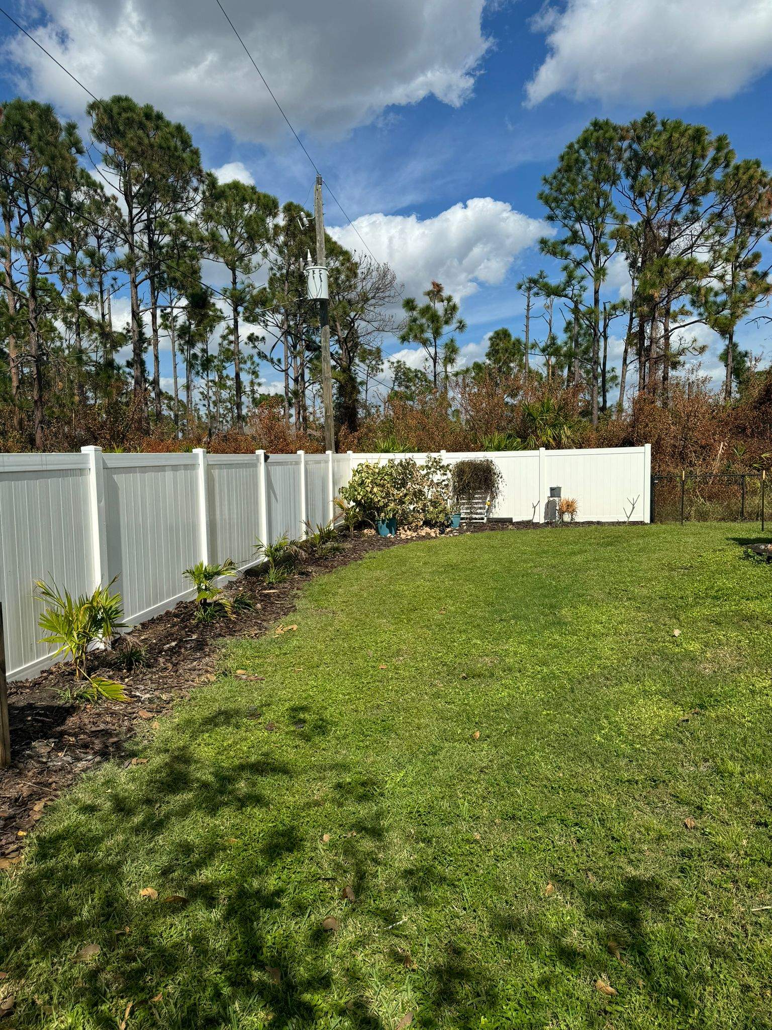 White Vinyl Privacy Fence Installation in Port Charlotte by True Fence LLC