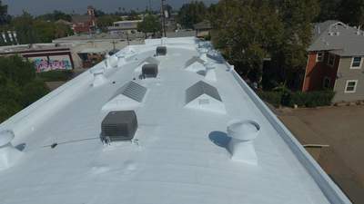 Polyurethane foam roof refurbish and recoating