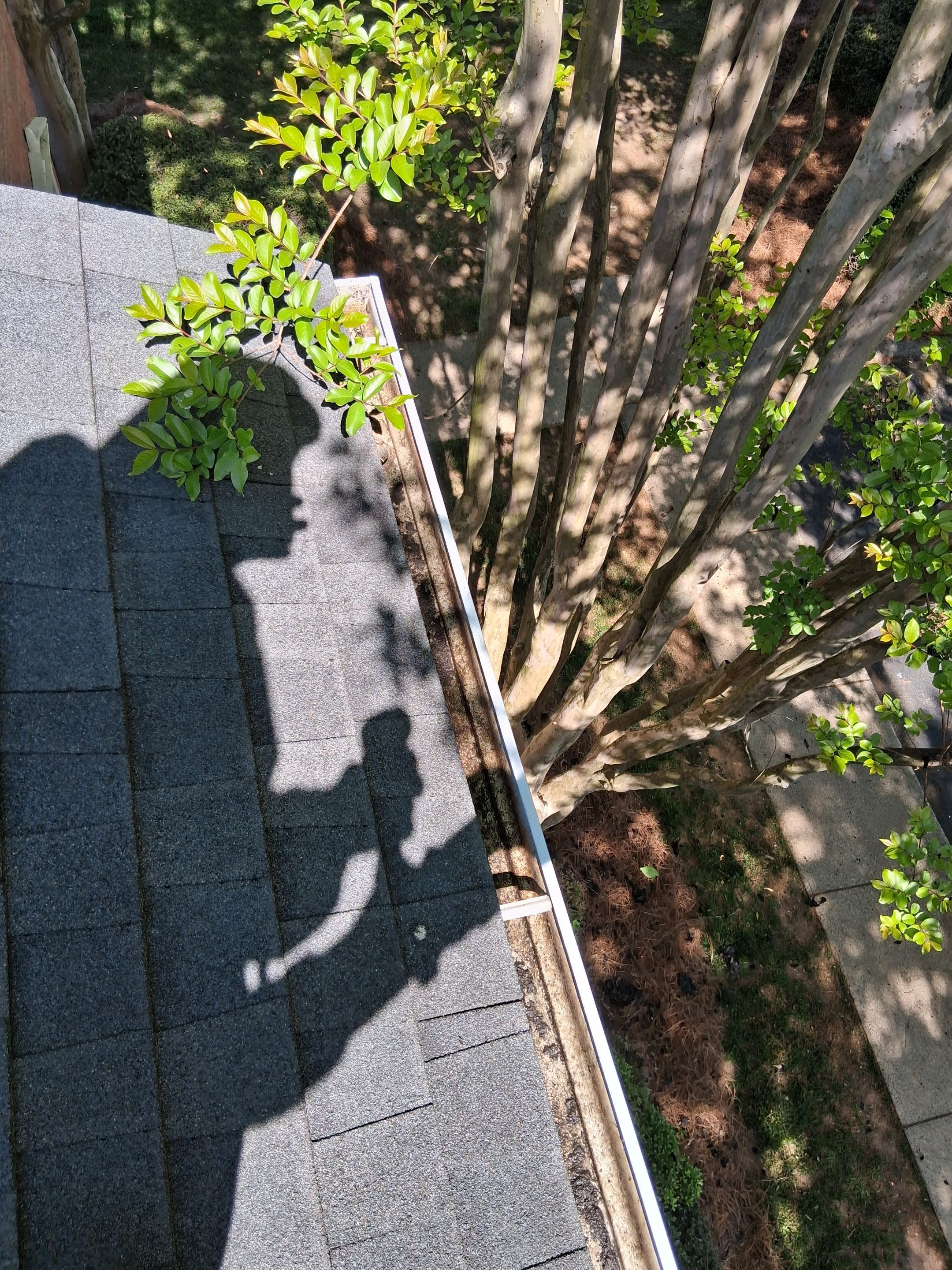 HOA gutter cleaning in Mooresville & Lake Norman, NC, after  photo showing full gutters.