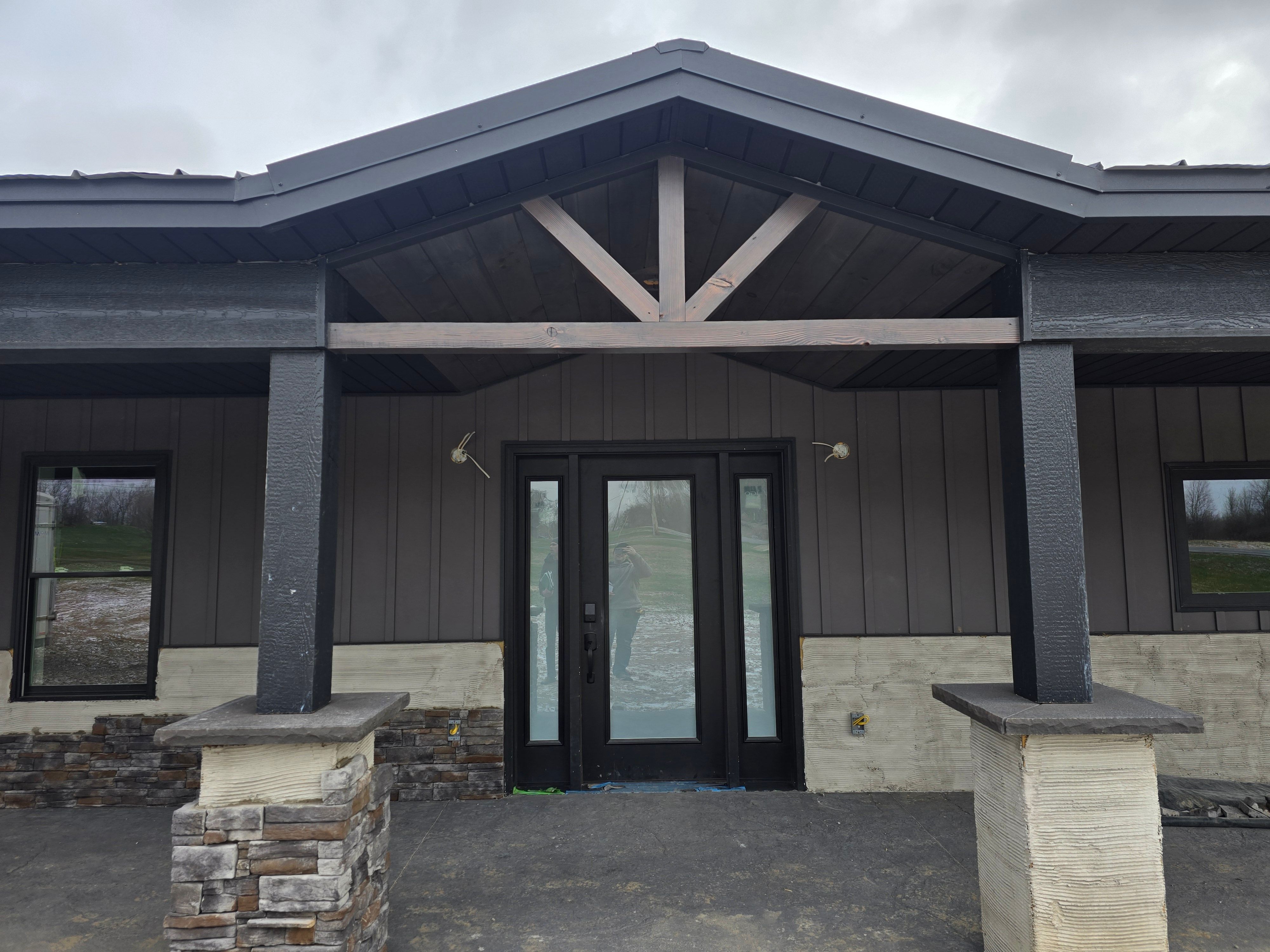 Barndominium  using Textured Board & Batton by Horst Custom Homes 