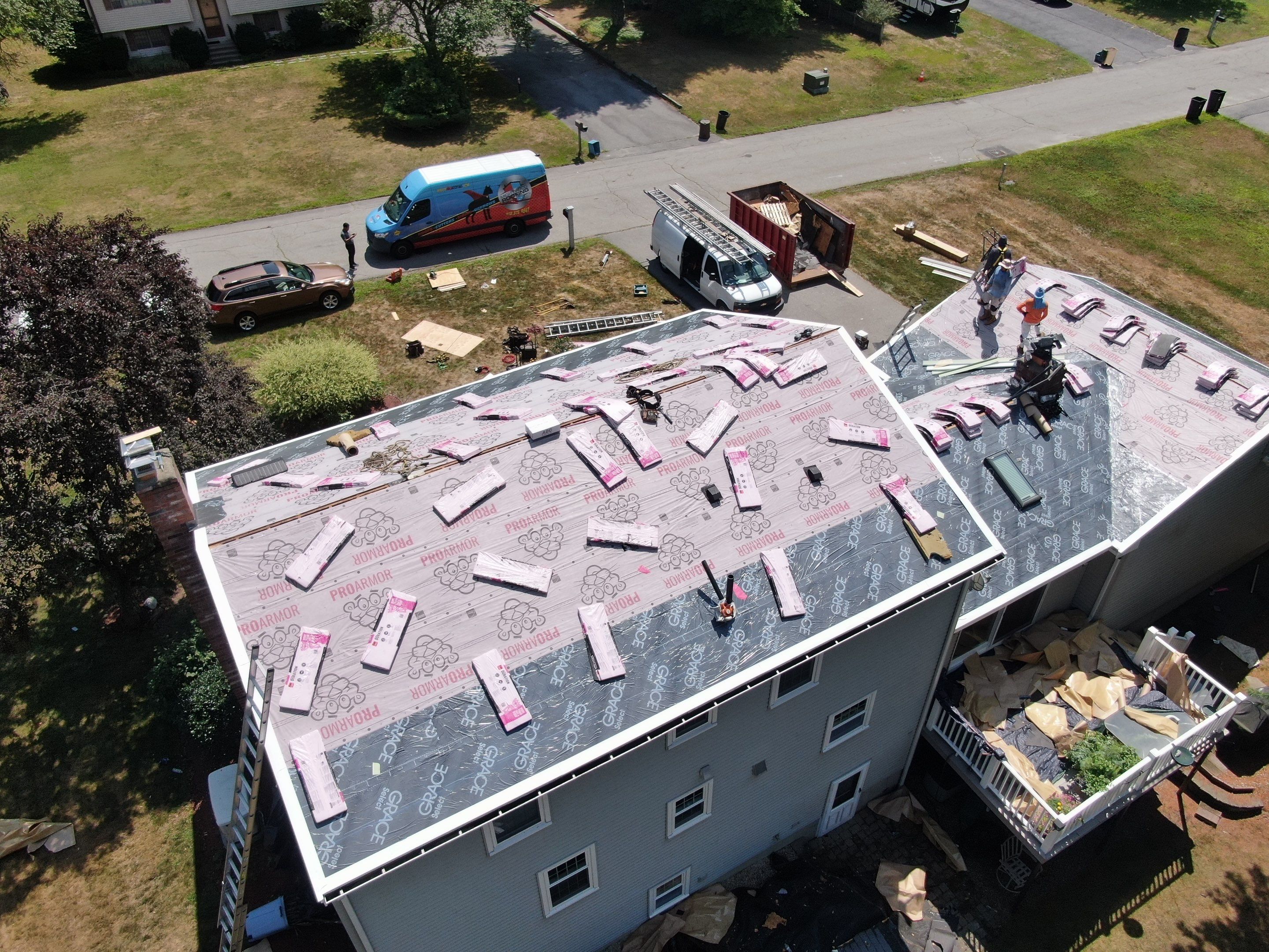 Complete Roof Replacement with Chimney Flashing, Gutter Guard System, and Vinyl Siding Repairs by Mighty Dog Roofing of Greater Middlesex County