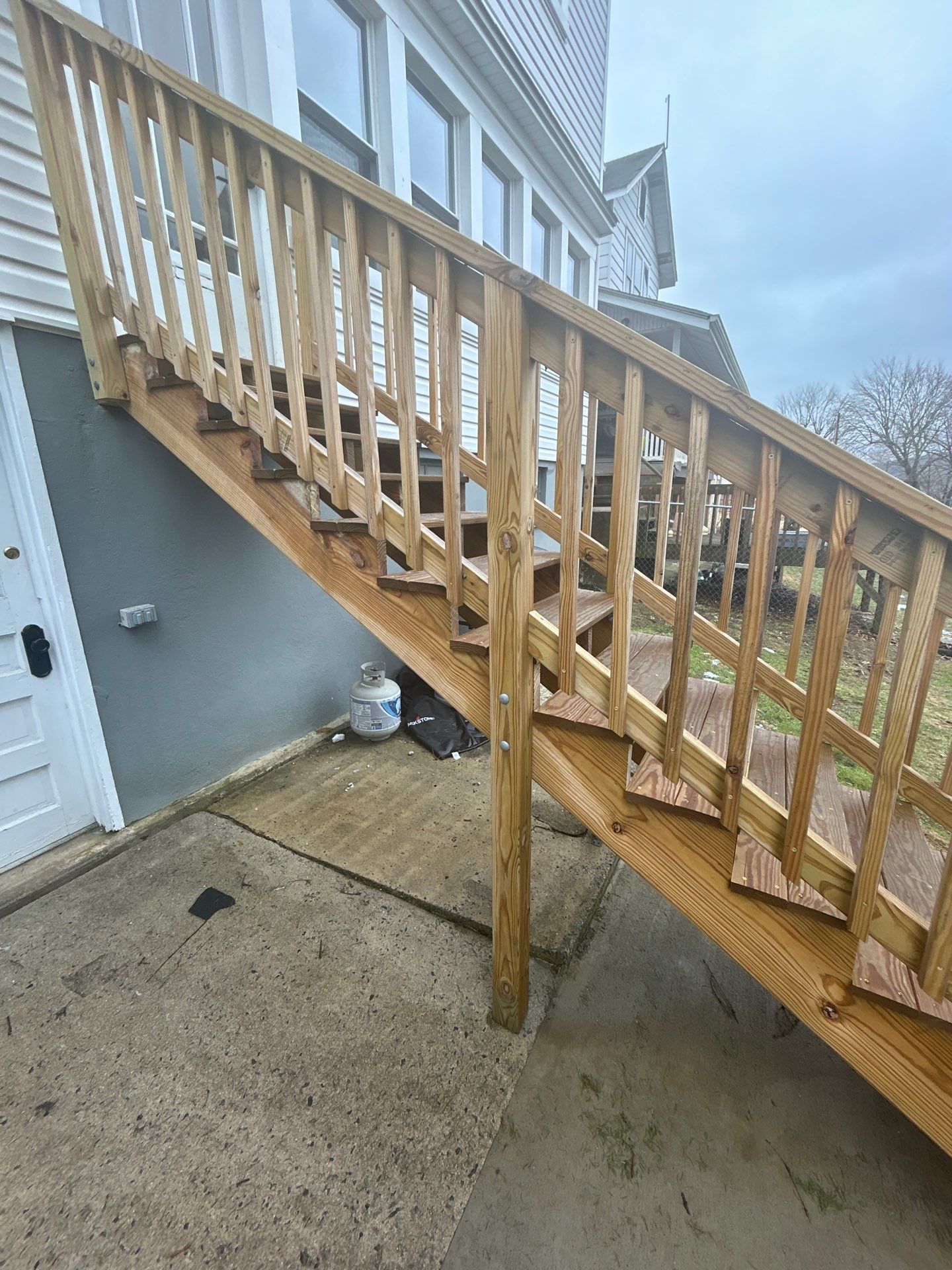 Pressure-Treated Wooden Staircase and Concrete Footing Installation in Schuylkill Haven by Herts Roofing & Construction