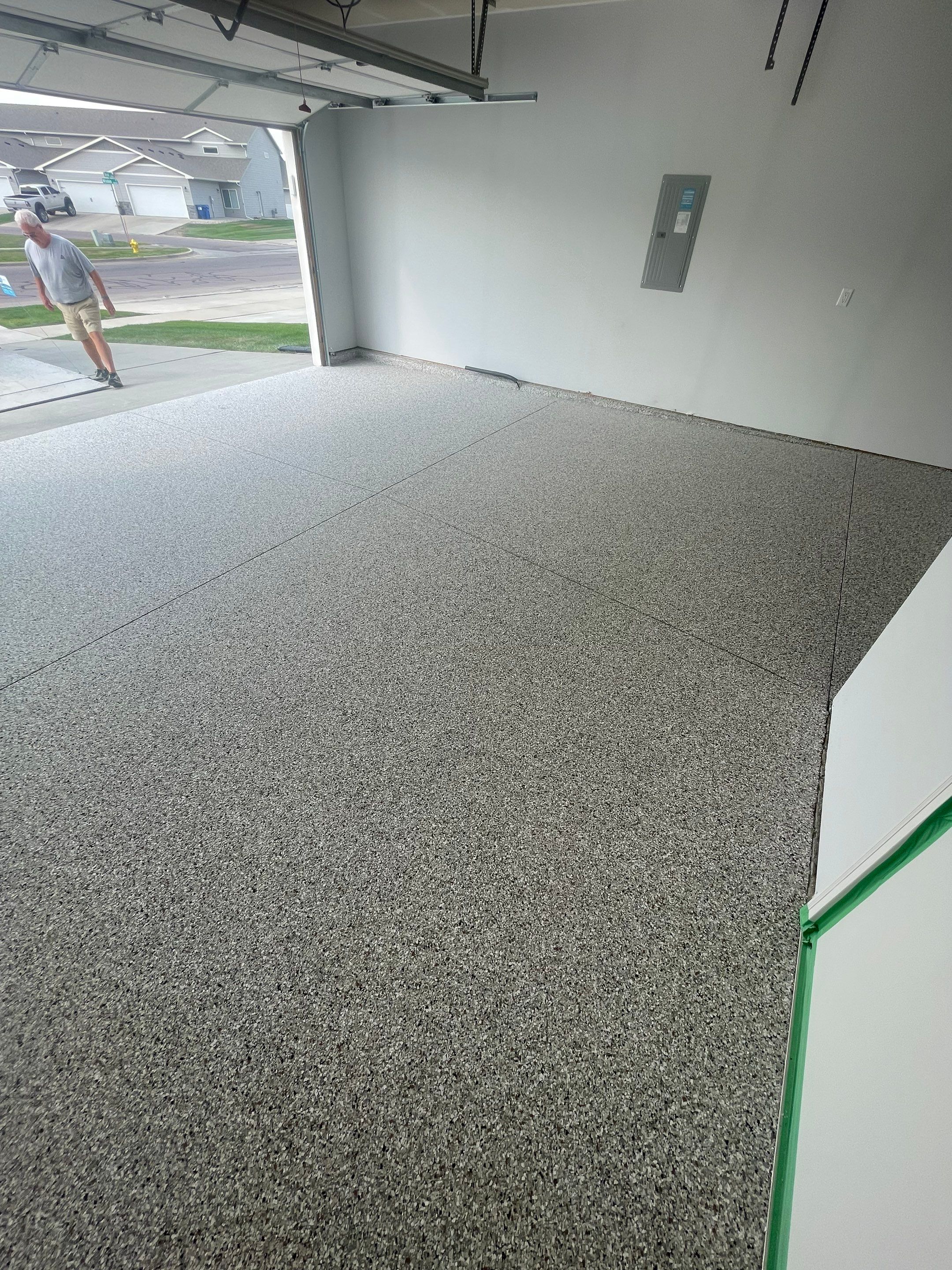 Custom Coyote Flake Garage Floor Coating in Sioux Falls by Select Painting, Coatings & Garage Cabinets