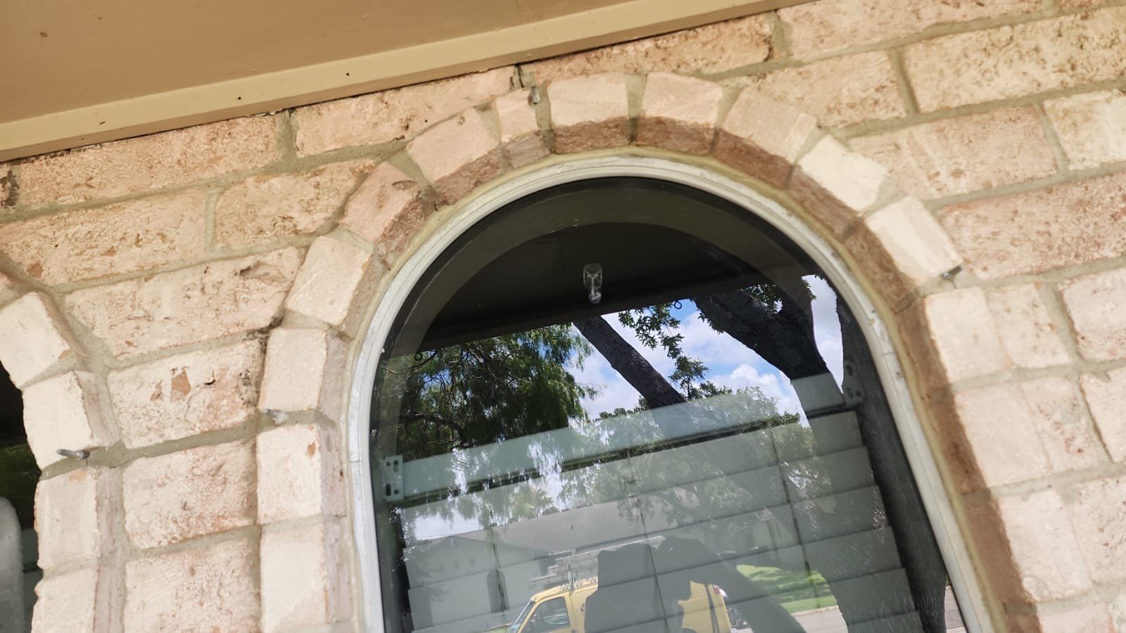 Colored Vinyl Windows to blend into brick by Bayfront Roofing and Construction