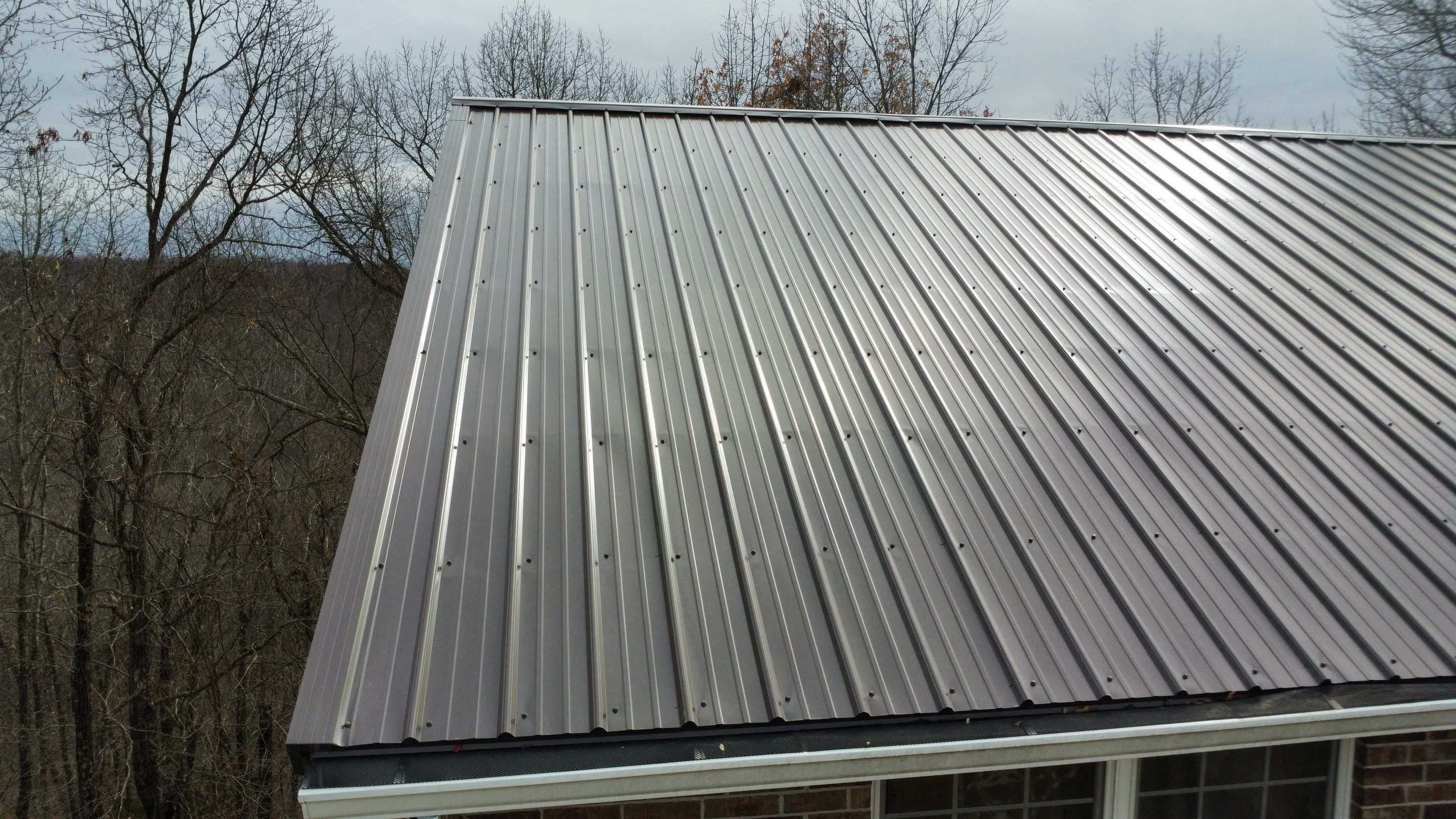 Residential Roofing Install - 29 Gauge G-Rib Metal - Color Burnished Slate  by Titan Commercial & Residential Roofing 