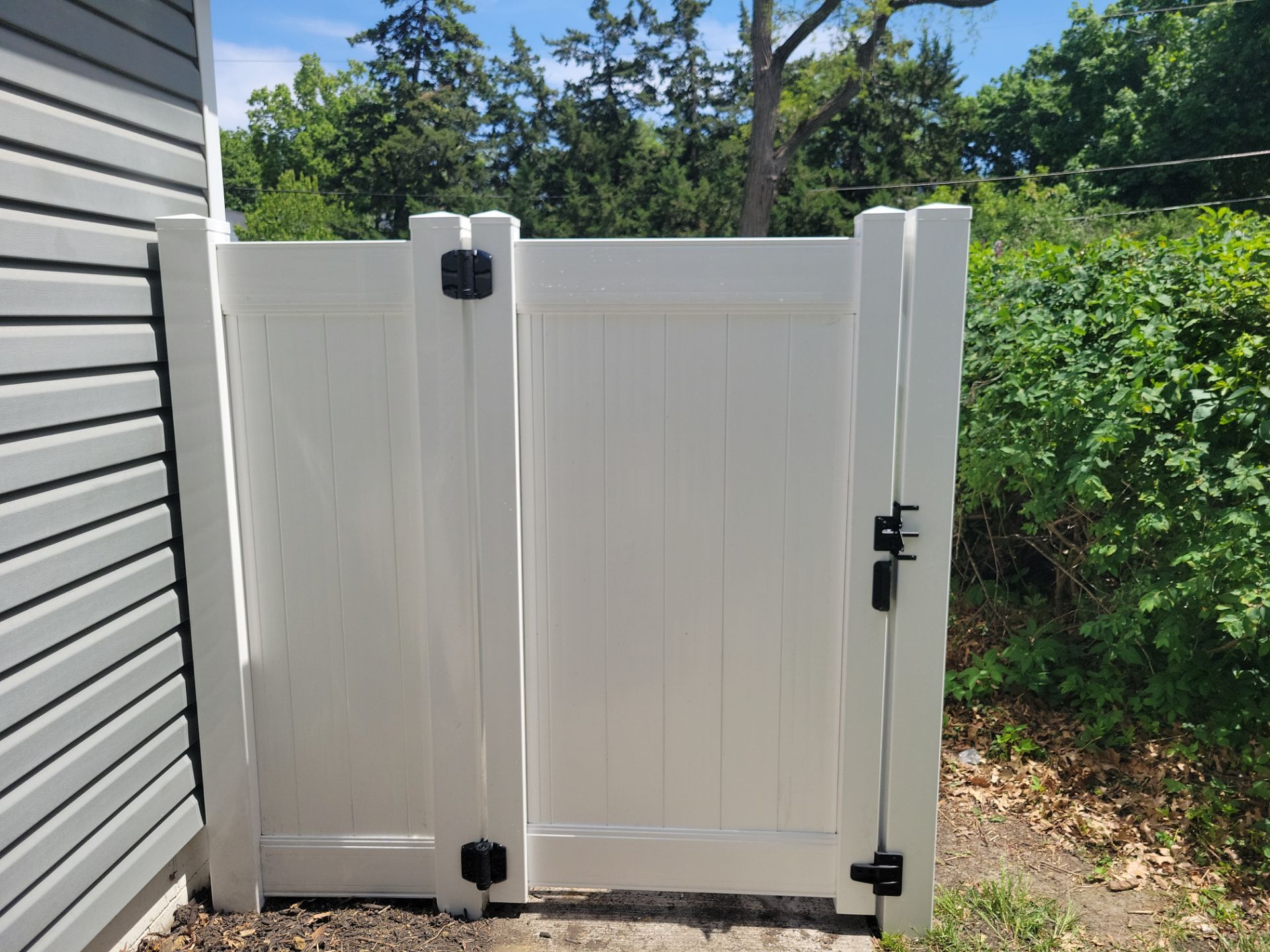 Residential White Vinyl Privacy Fence Installation in Waterloo by Perfect Picket Fence and Stain