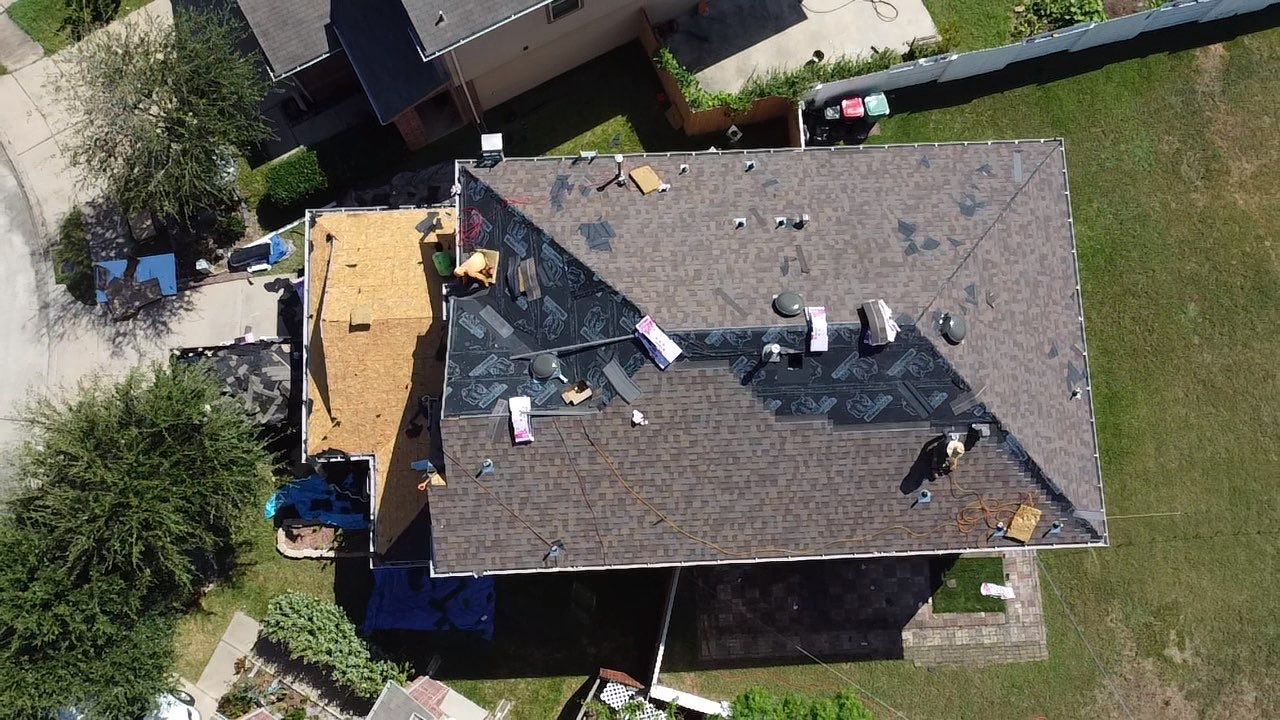 Owens Corning Shingle Roofing Replacement for Houston Two-Story Home by Houston Roofing & Construction