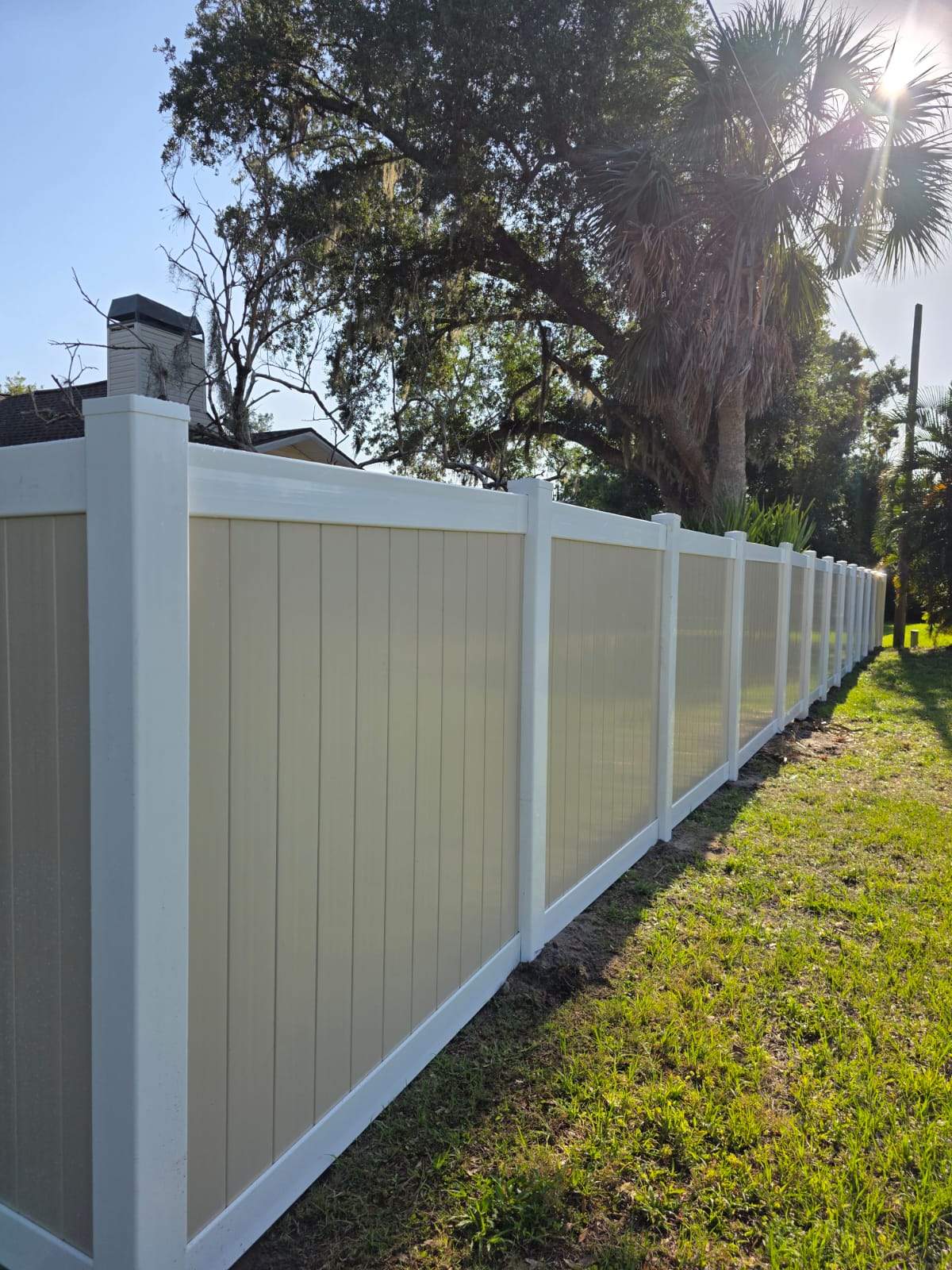 Two-Tone Vinyl Privacy Fence Installation in Port Charlotte by True Fence LLC