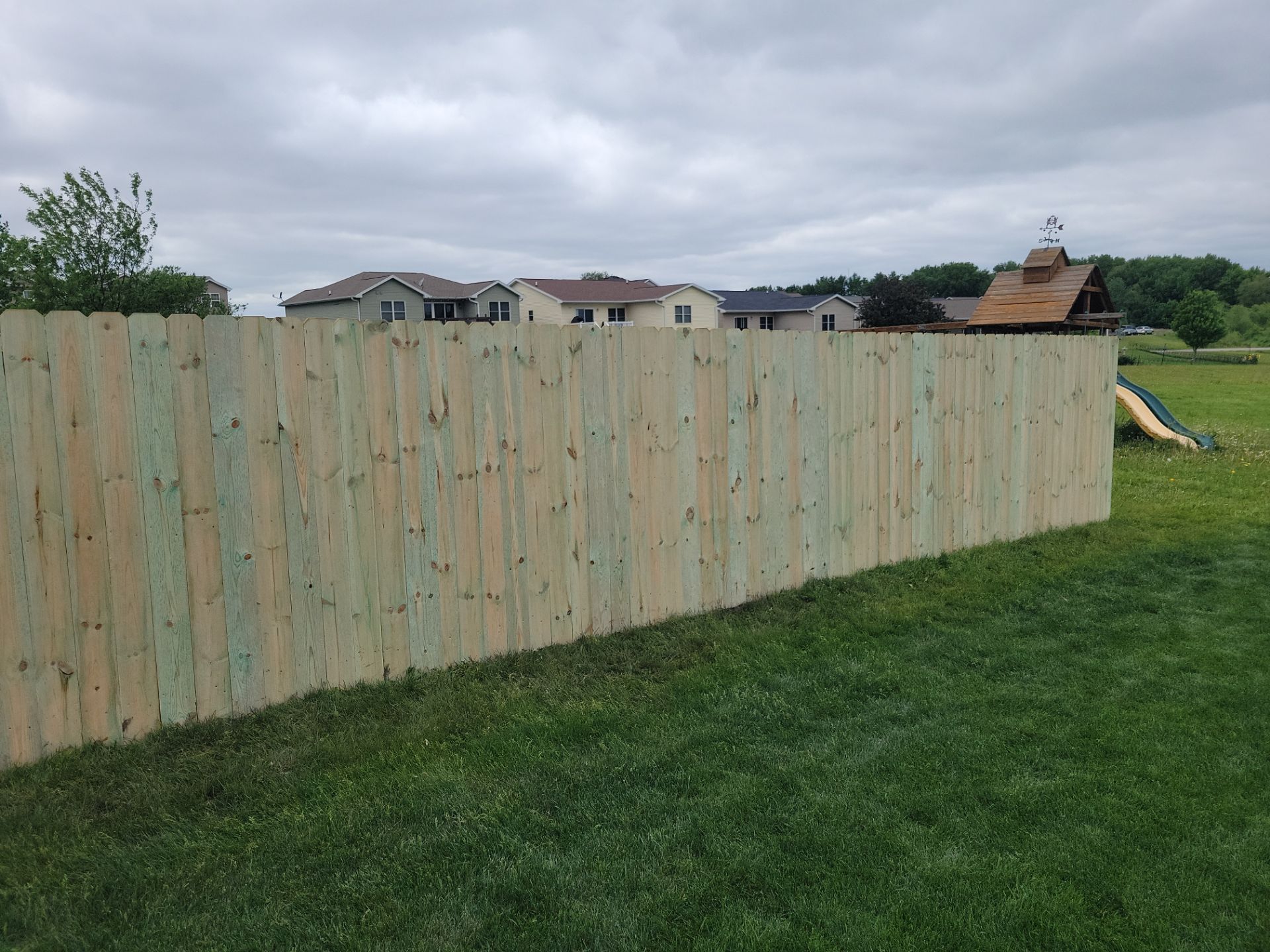 Pressure-Treated Wood Privacy Fence Installation in Waterloo by Perfect Picket Fence and Stain