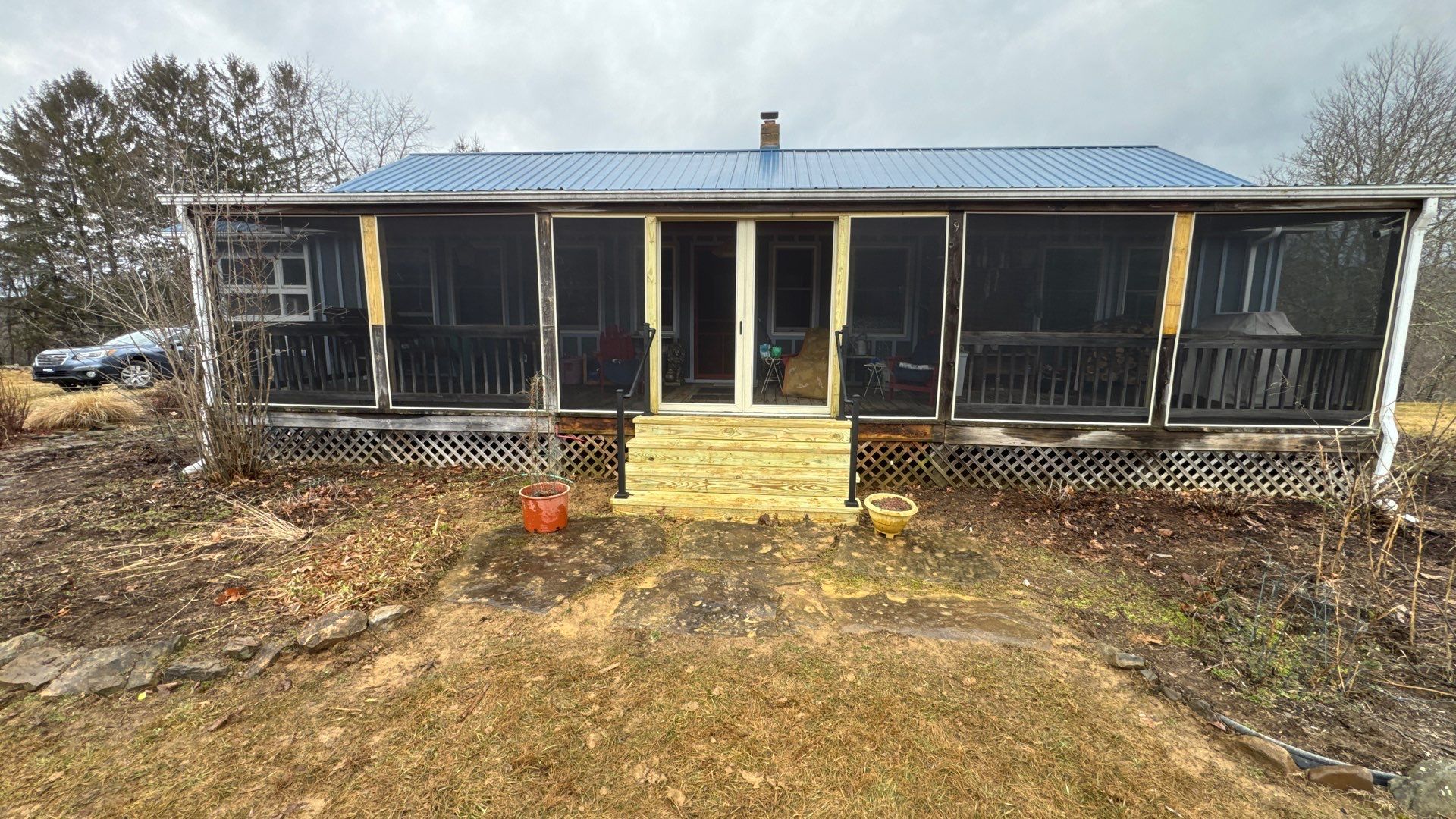 Renick Screened-In Porch Build with Custom Pressure-Treated Stairs by Walnut Hollow Decks & Outdoor Living