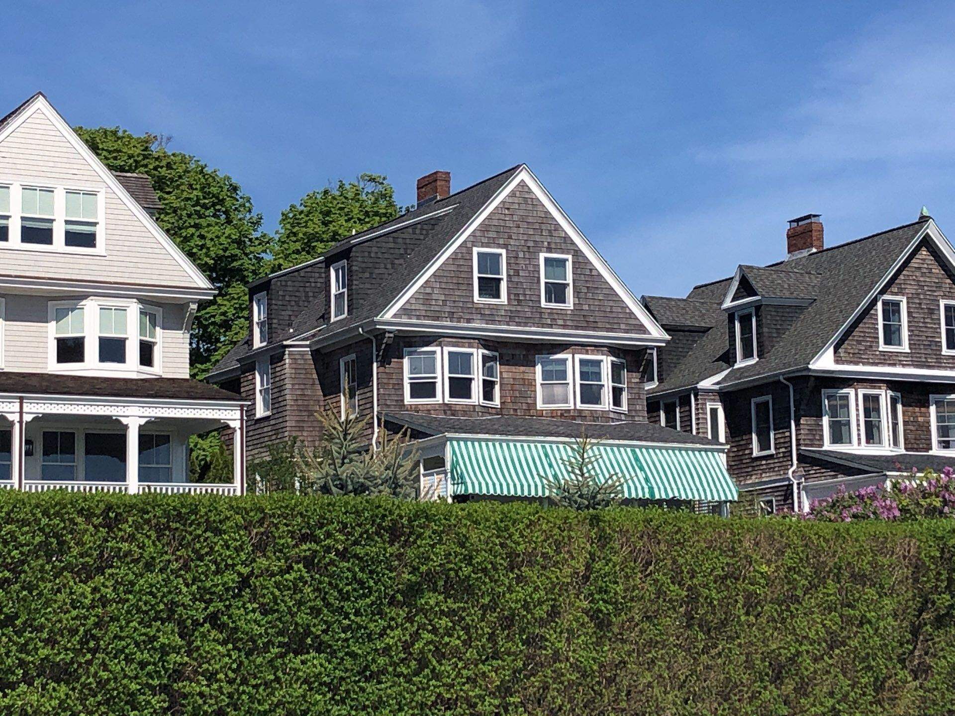 Pewterwood Roofs by Pinnacle Roofing & Skylights