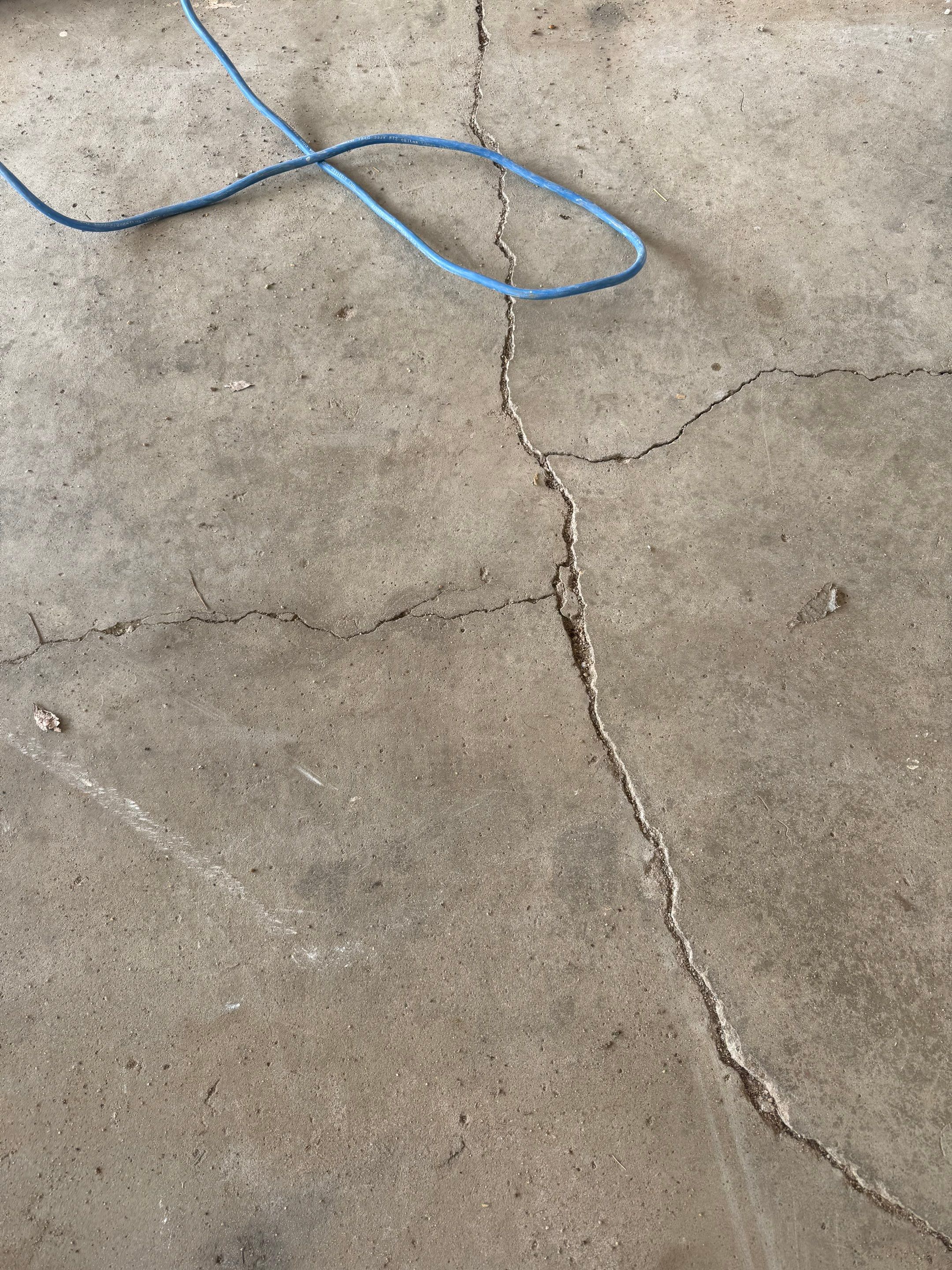 Feather Grey Garage Floor Coating and Crack Repair in Beresford by Select Painting, Coatings & Garage Cabinets