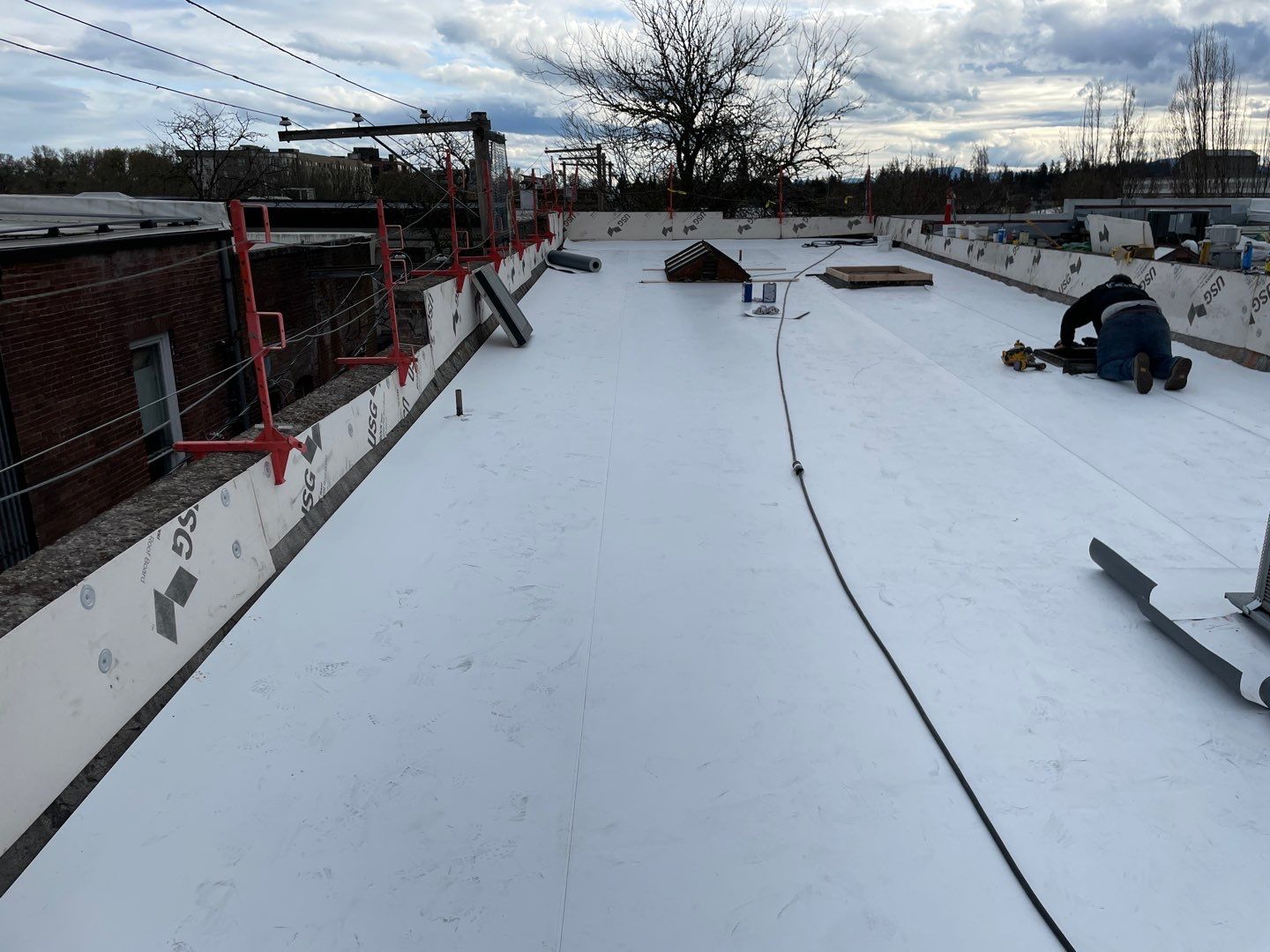 Commercial Flat Roof Installation using GAF 60Mil TPO  by Orezona Building & Roofing Company, Inc.
