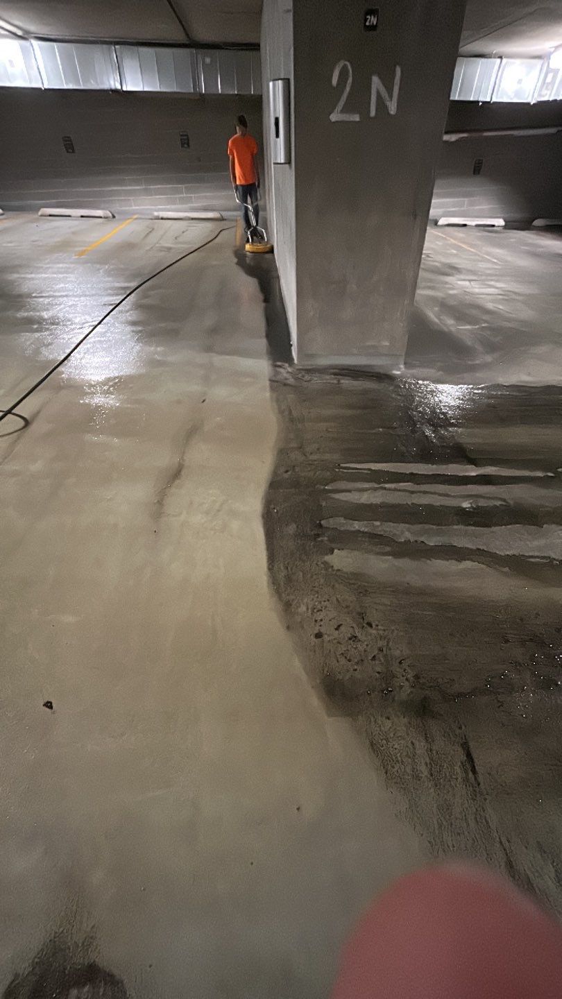 Parking garage using Hot water by Northern Power Washing LLC.