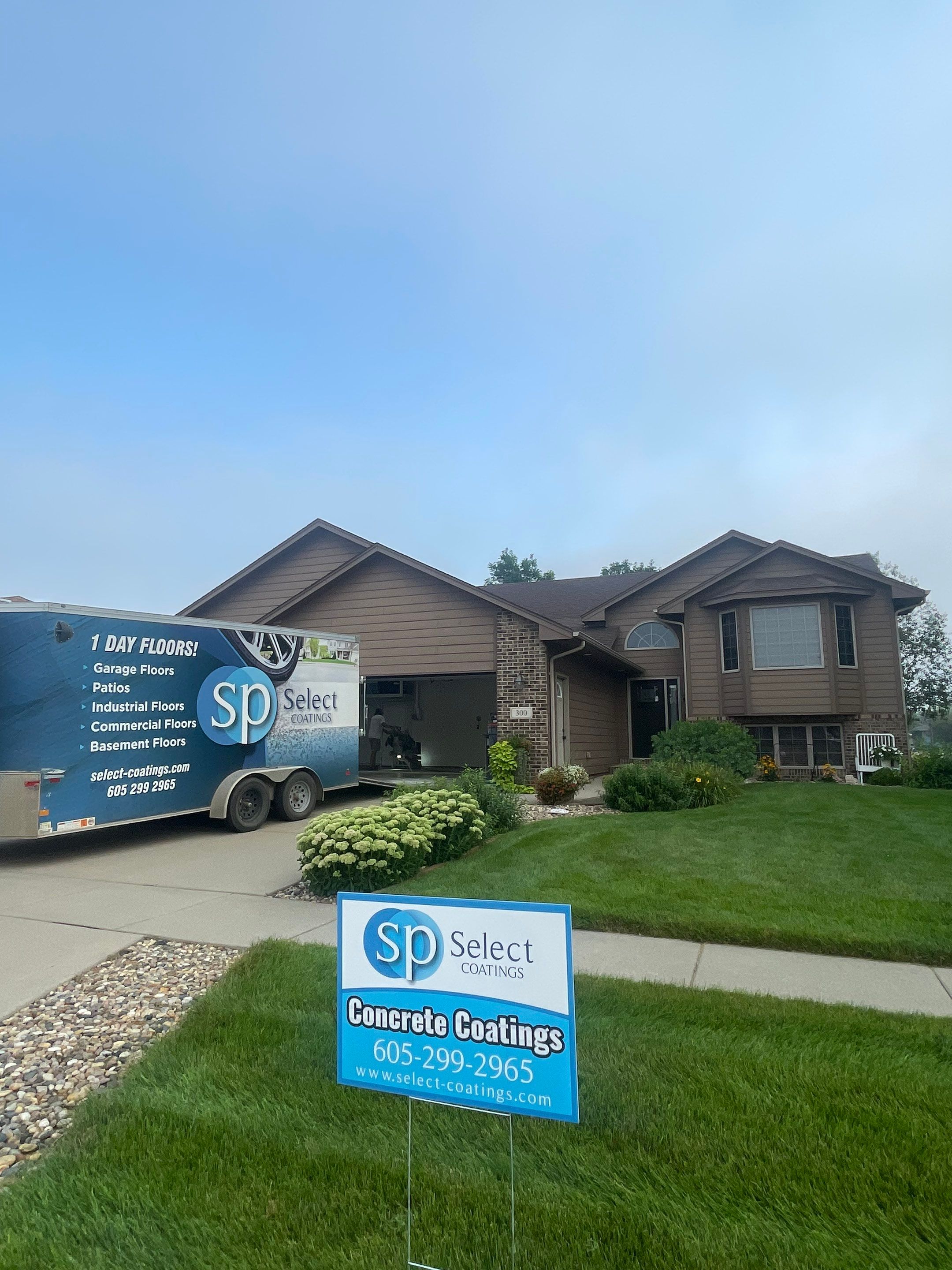 Multi-Car Garage Floor Coating and Crack Repair in Tea by Select Painting, Coatings & Garage Cabinets