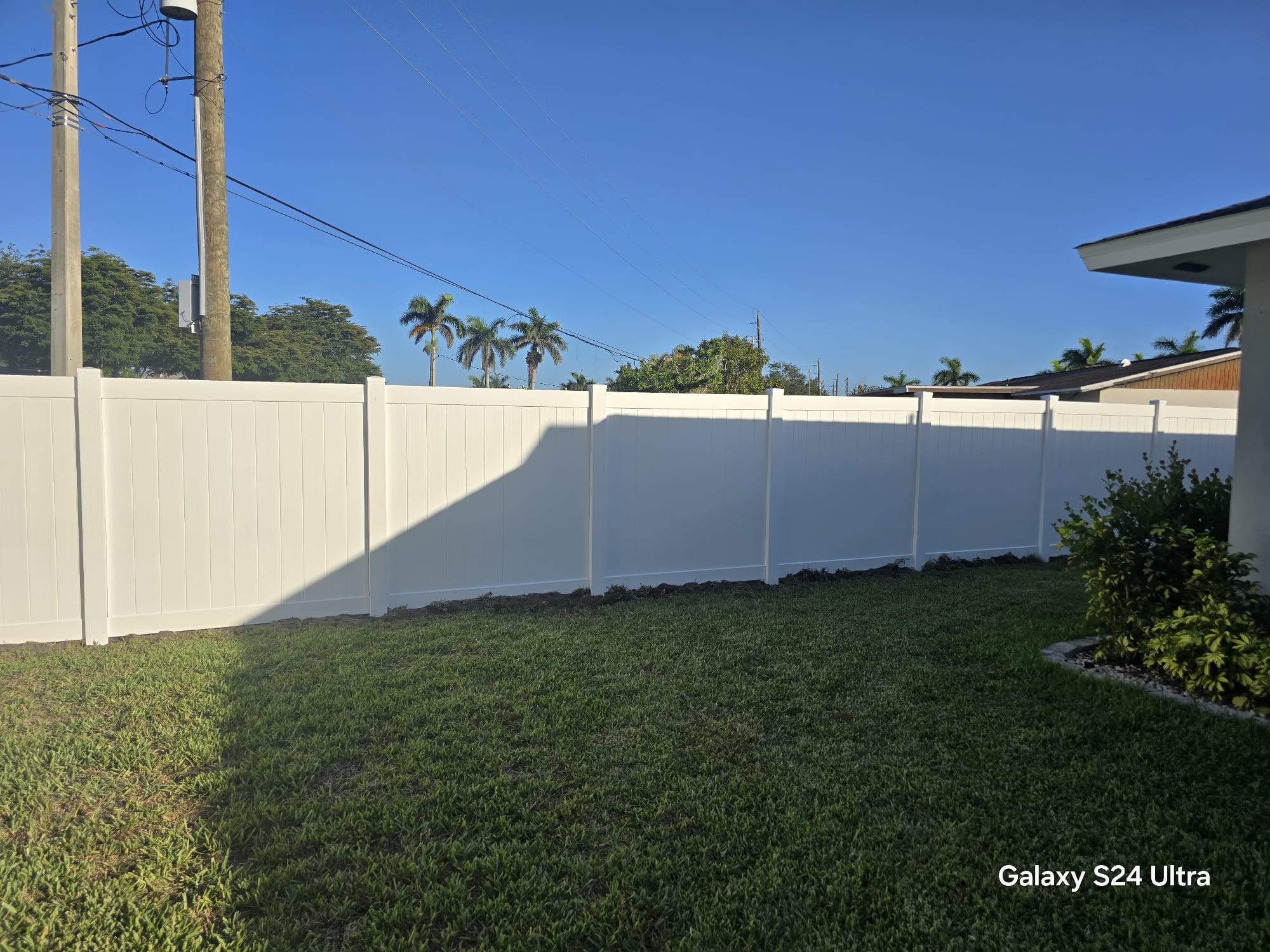 White Vinyl Privacy Fence and Double Gate Installation in Fort Myers by True Fence LLC