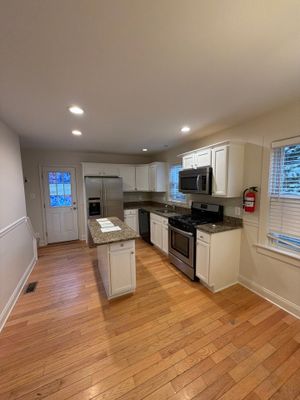 A Whole Home Refresh with Soft Whites and Custom Cabinet Finishing