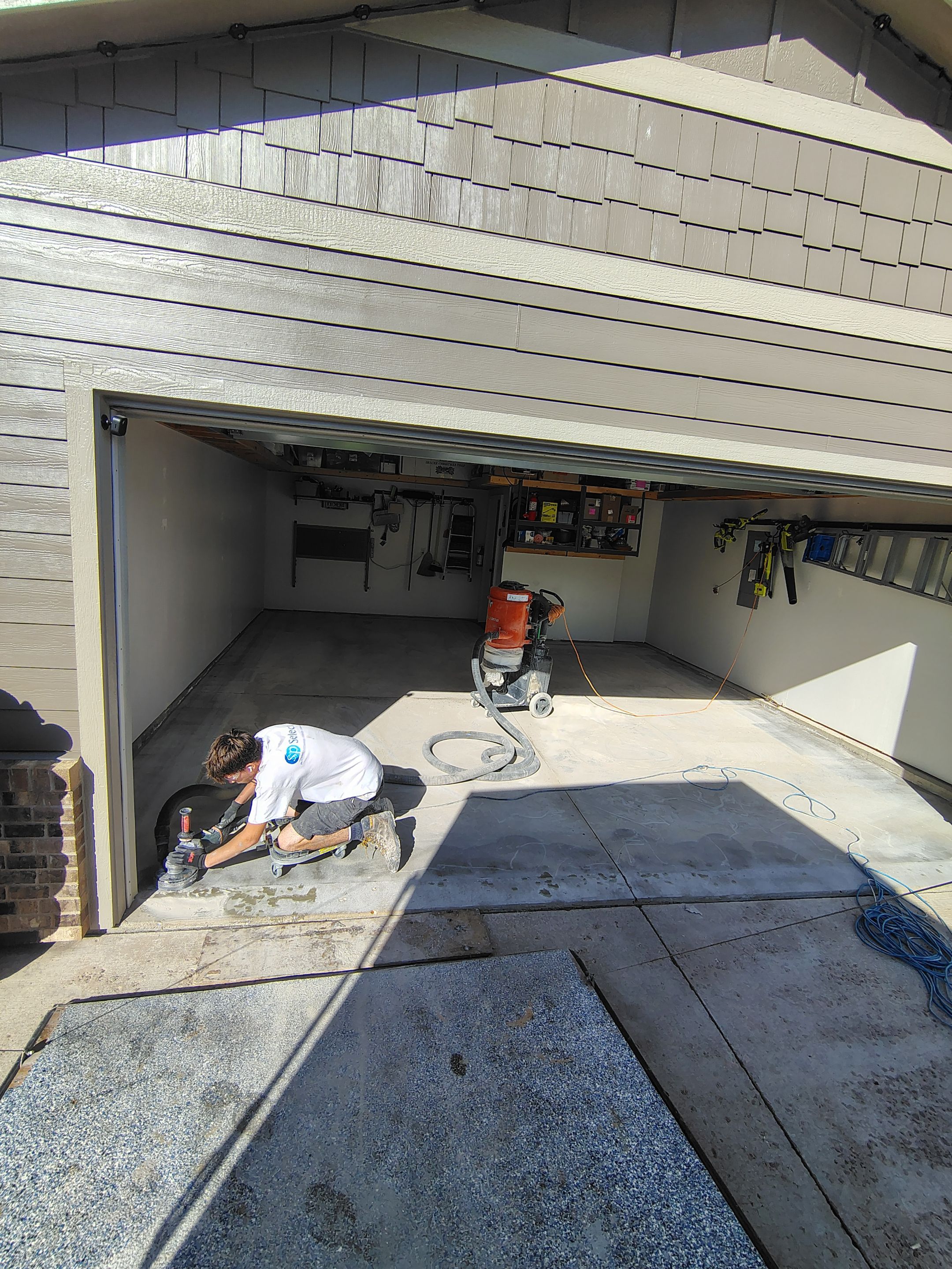 Decorative Chip Garage Concrete Coating Installation in Sioux Falls by Select Painting, Coatings & Garage Cabinets