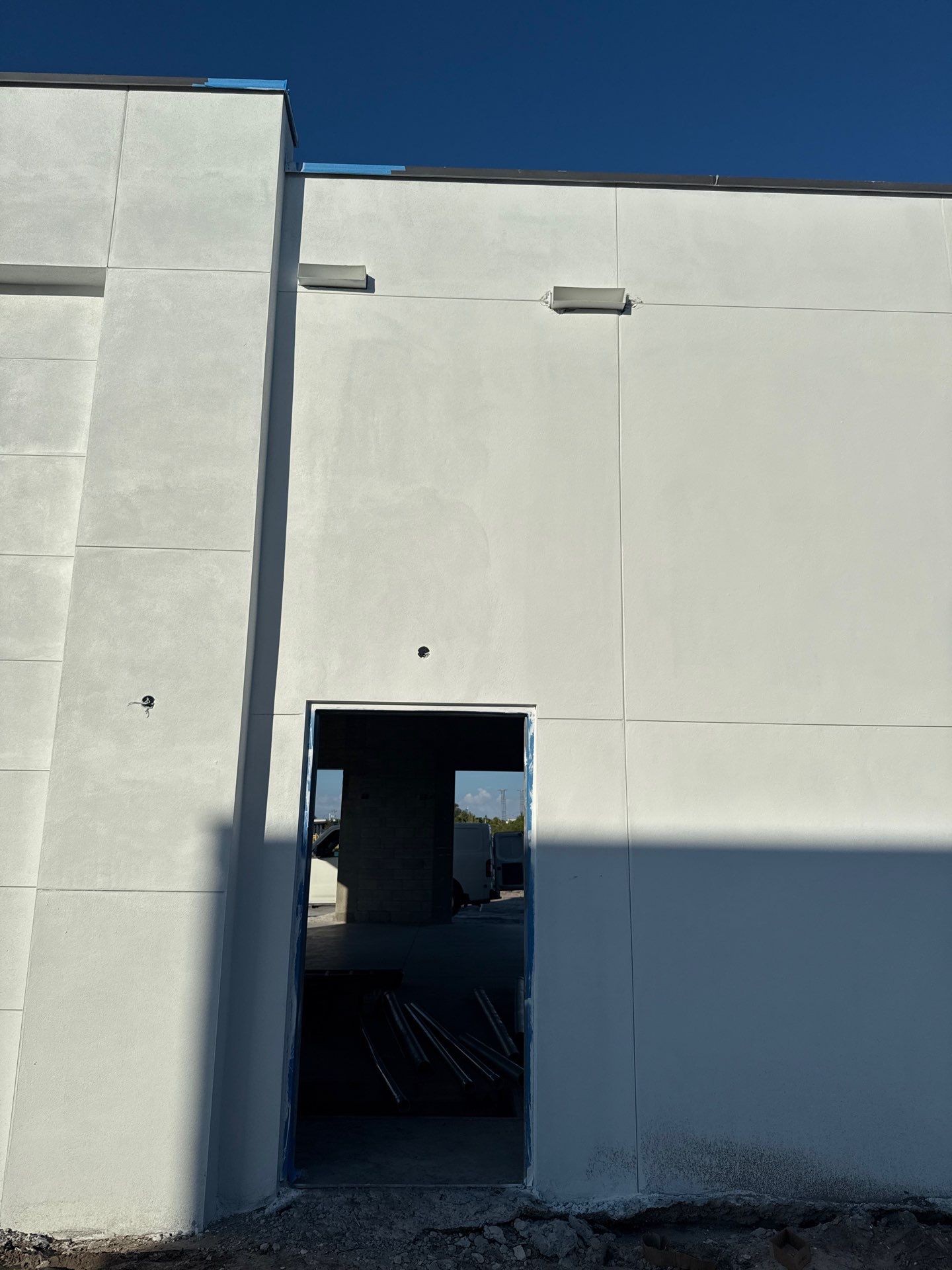 Downspout Installation using collector head in Cape Coral FL by Gutter Professors