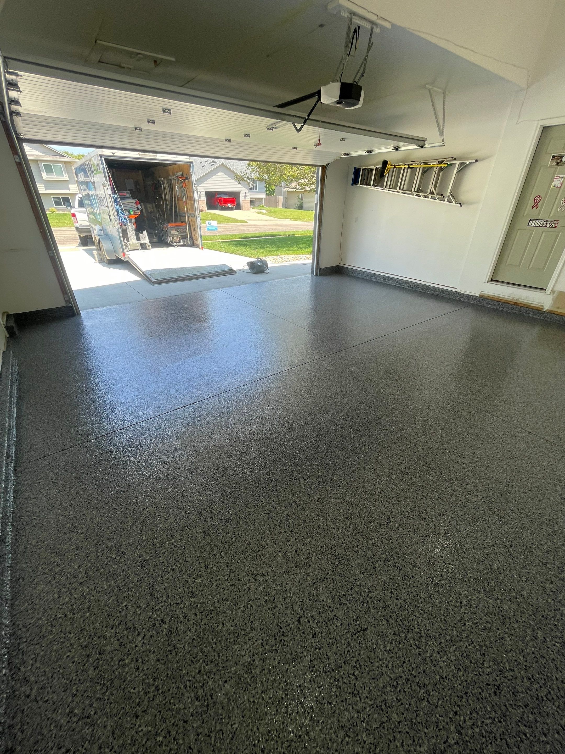 Sioux Falls Garage Floor Coating with Nightfall Decorative Chips by Select Painting, Coatings & Garage Cabinets