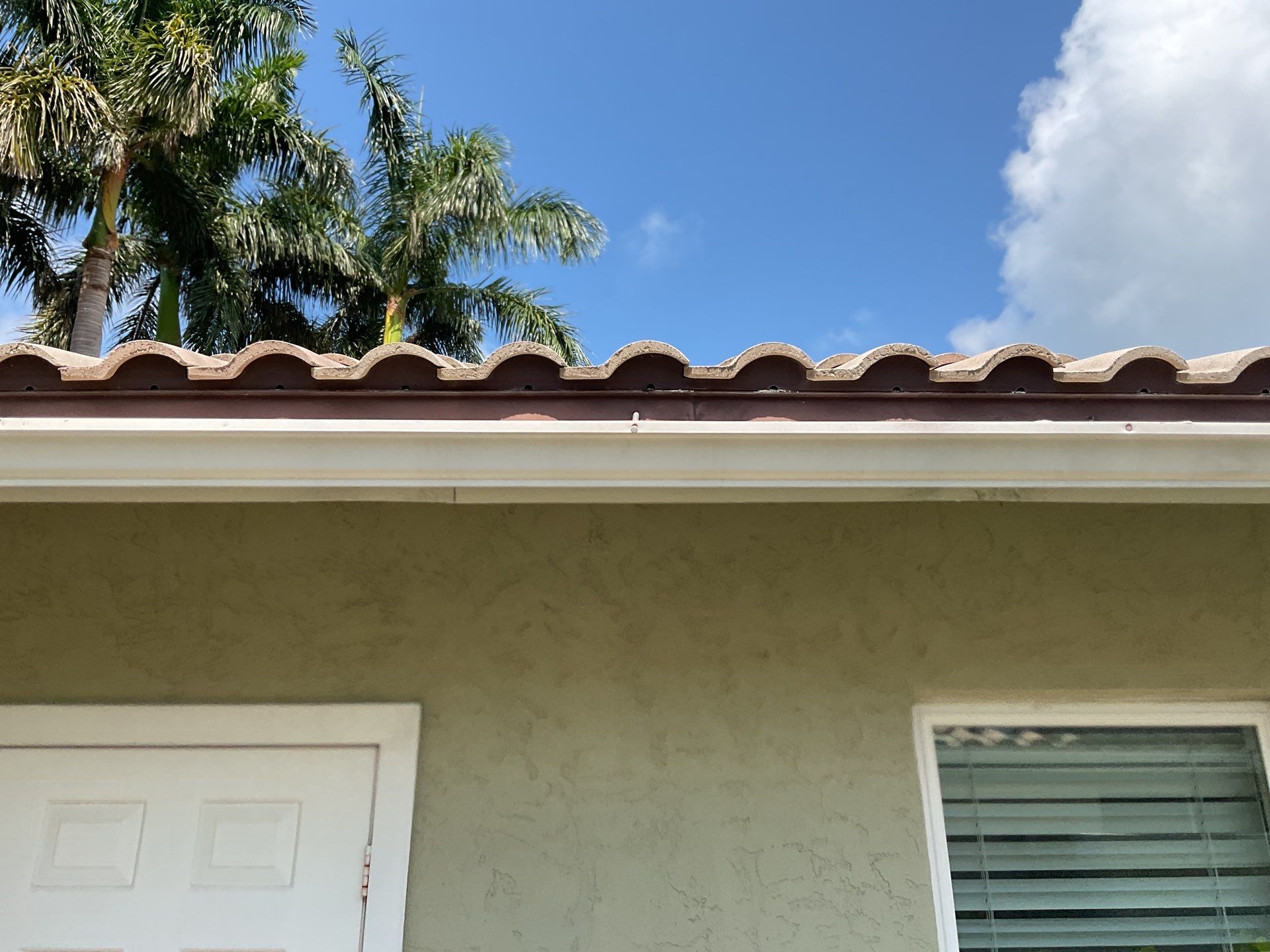 White Gutter Installation in Sarasota FL by Gutter Professors