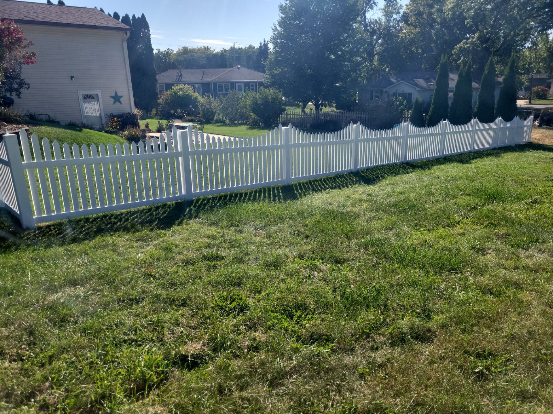 White Vinyl Spaced Picket Fence Installation in Waterloo by Perfect Picket Fence and Stain