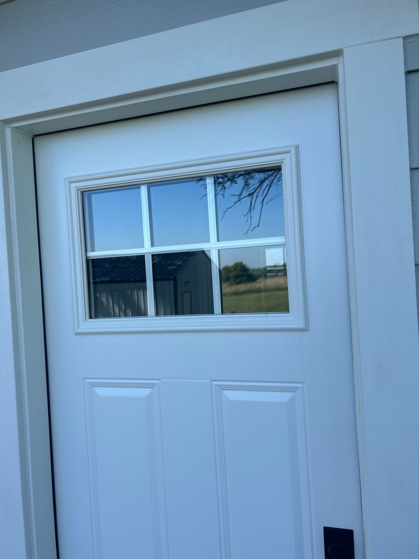 Light Mist Siding and Exterior Door Installation in Sidney by Carps Complete Exteriors