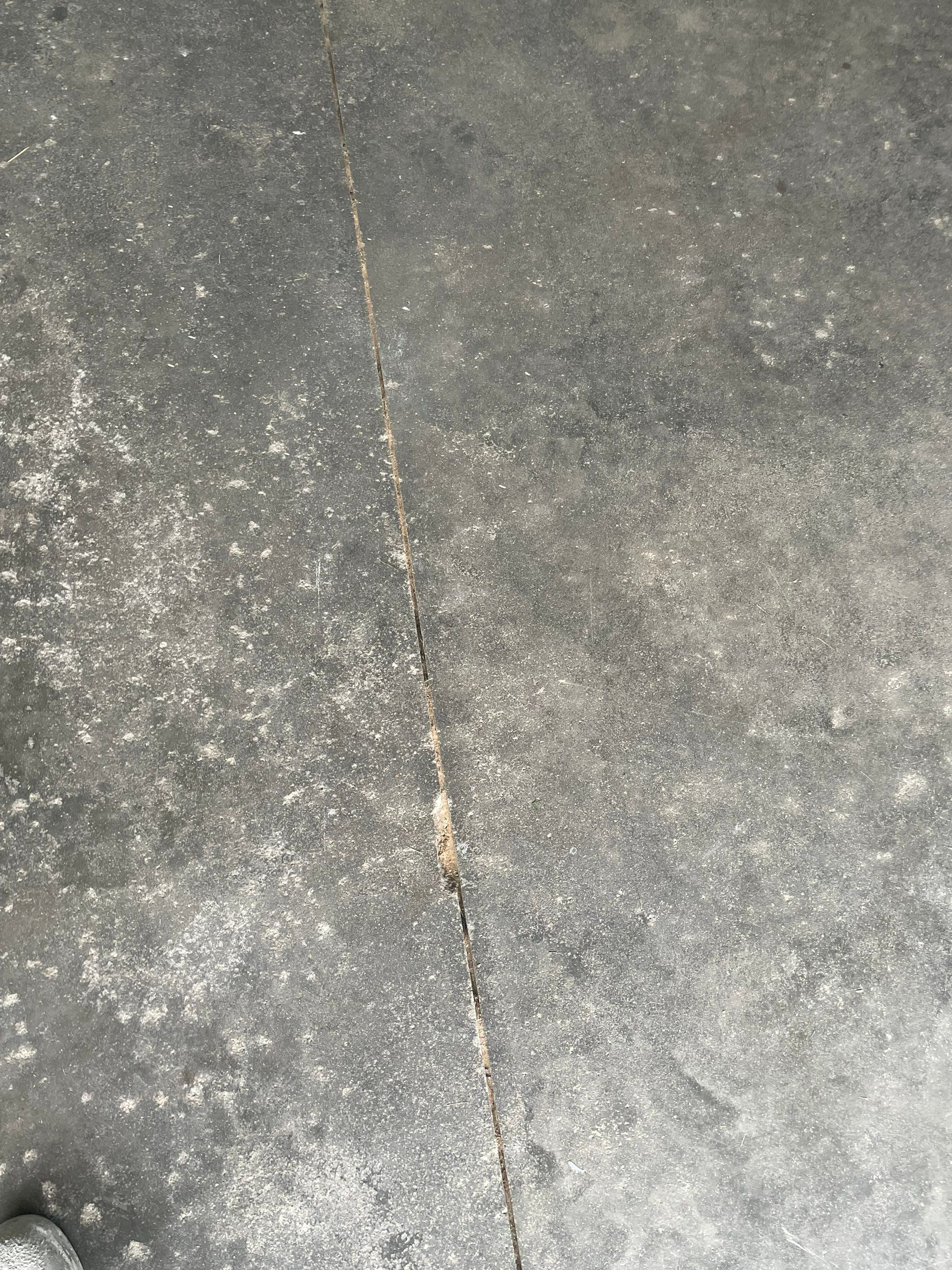 Cabin FEver Flake Garage Floor Coating Installation in Sioux Falls by Select Painting, Coatings & Garage Cabinets