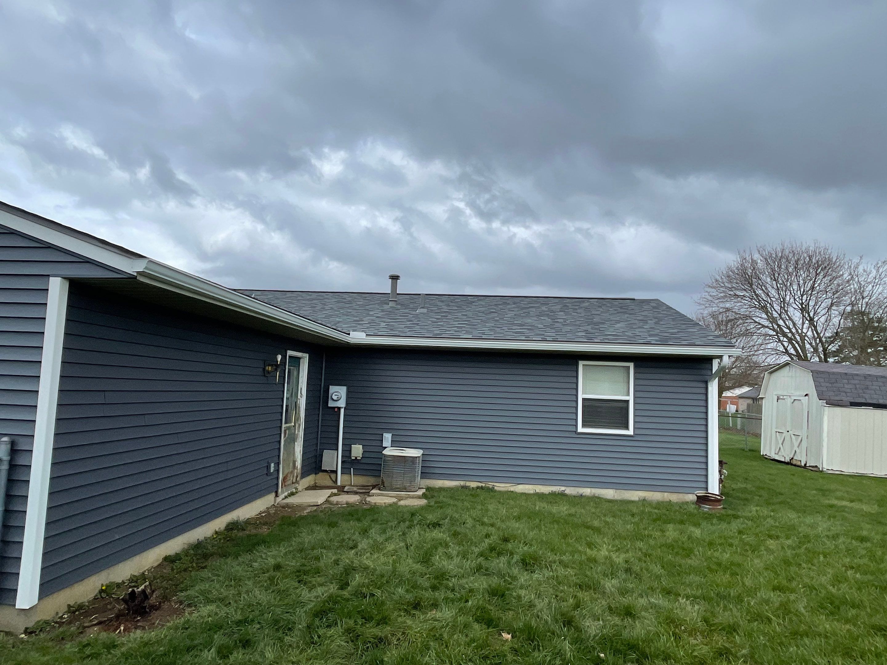 Storm Damage Residential Roof and Siding Installation by WIW Enterprises Inc