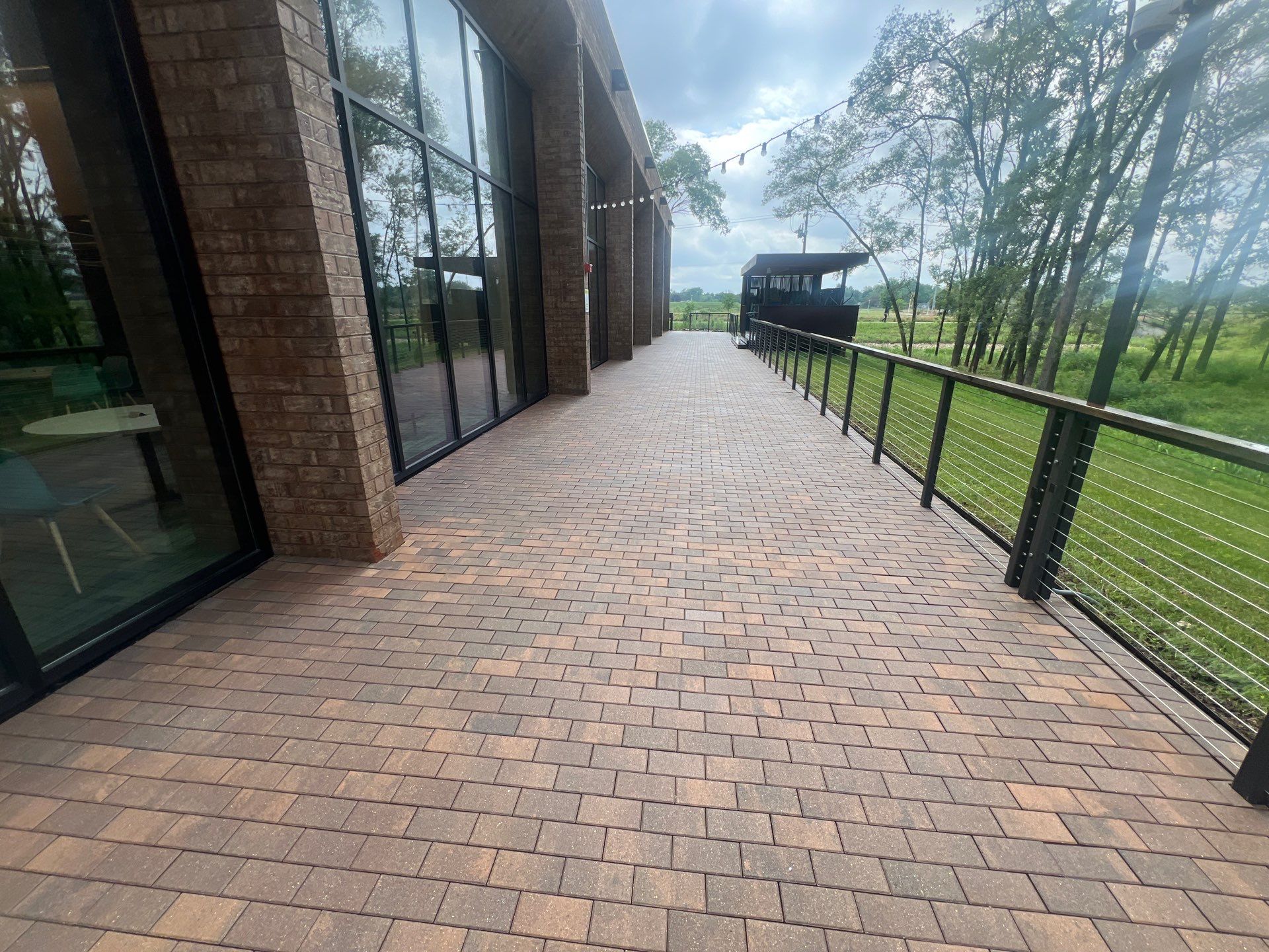 Brick paver repair, cleaning, sealing and poly sanding by Northern Power Washing LLC.