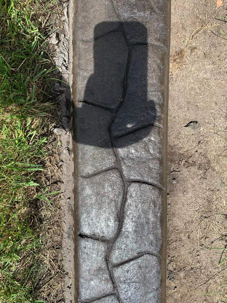 Decorative Stamped Concrete Garden Border Installation in Medicine Hat by Pump it Up Concrete Jacking