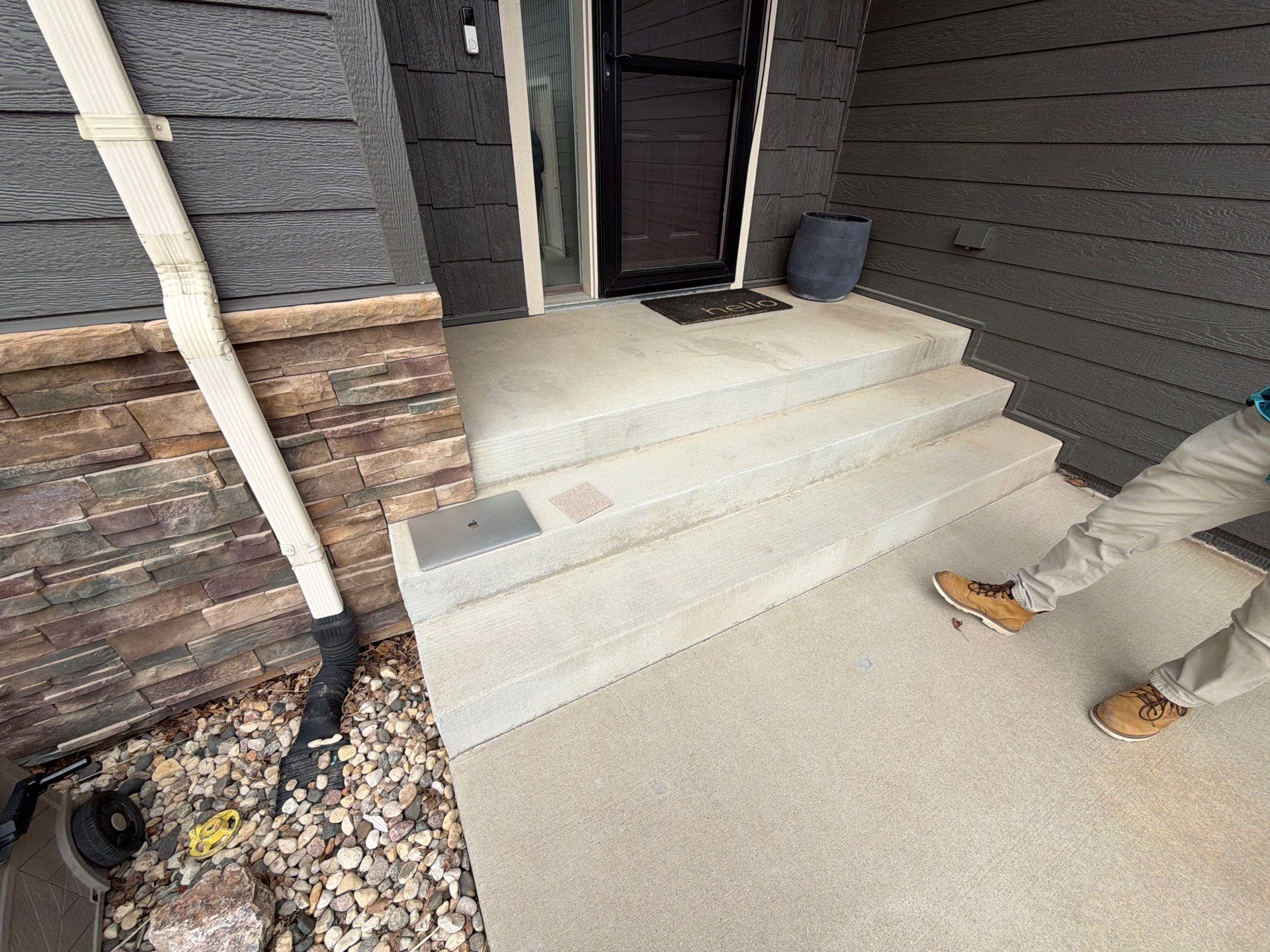 Feather Gray Epoxy Floor Coating Installation in Sioux Falls by Select Painting, Coatings & Garage Cabinets